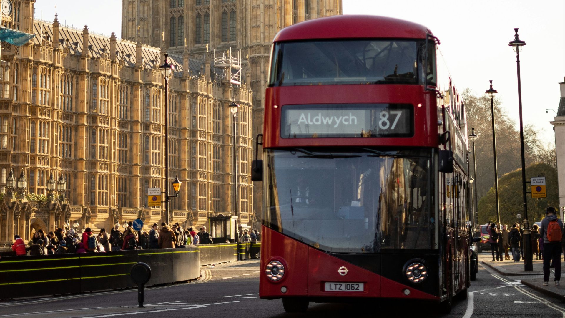 a double decker bus in front of a large building