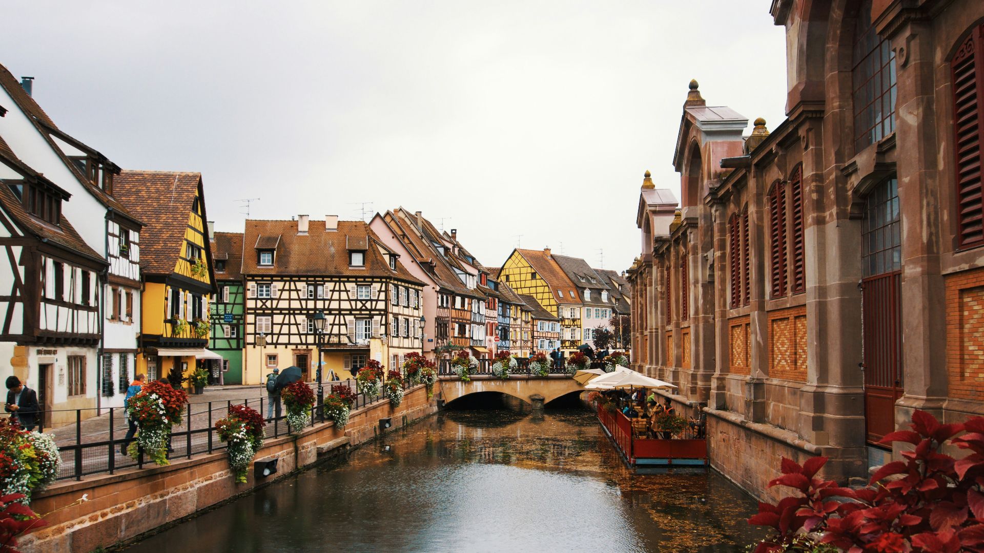 brown buildings near river