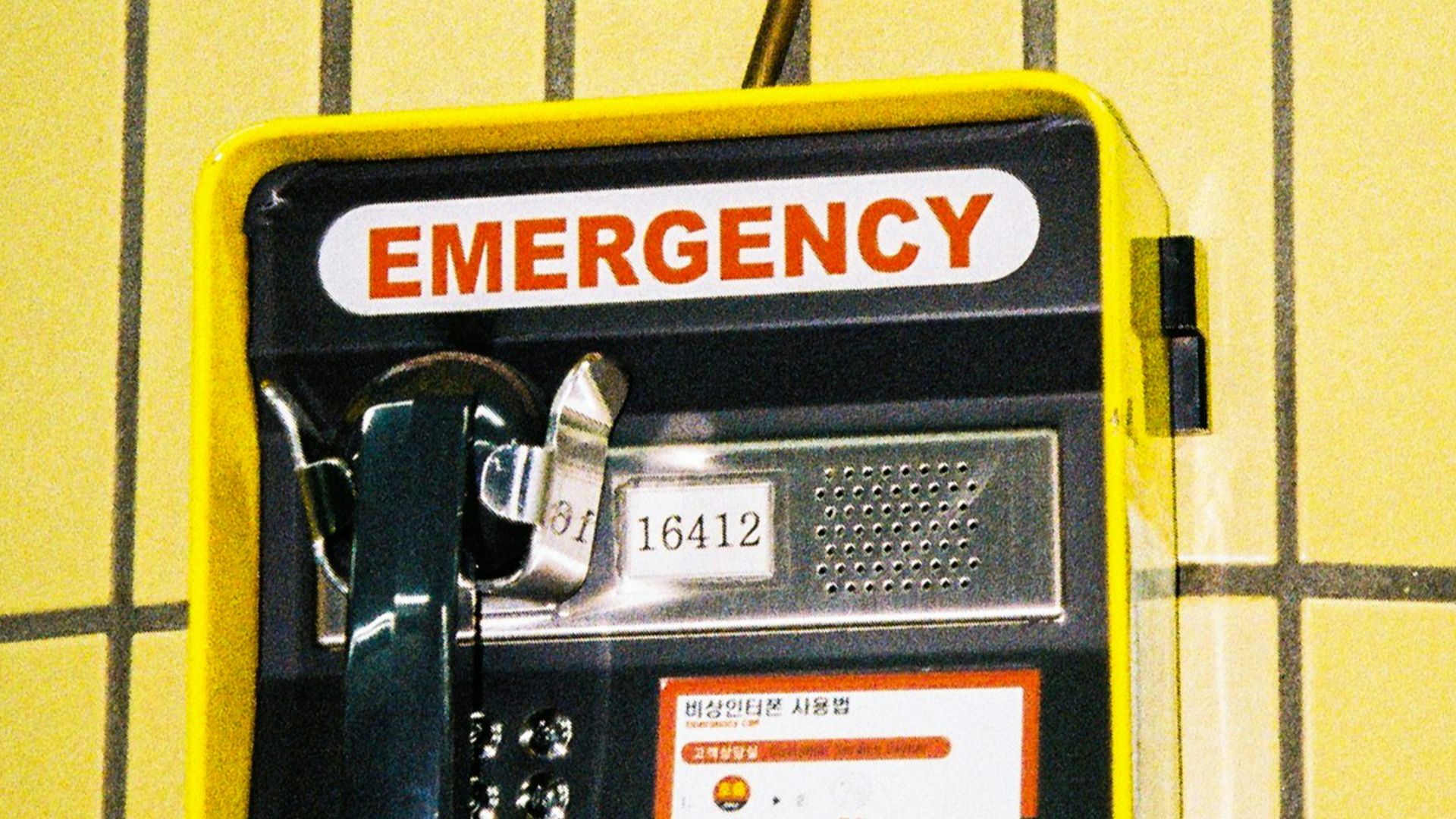 an emergency phone is attached to a wall