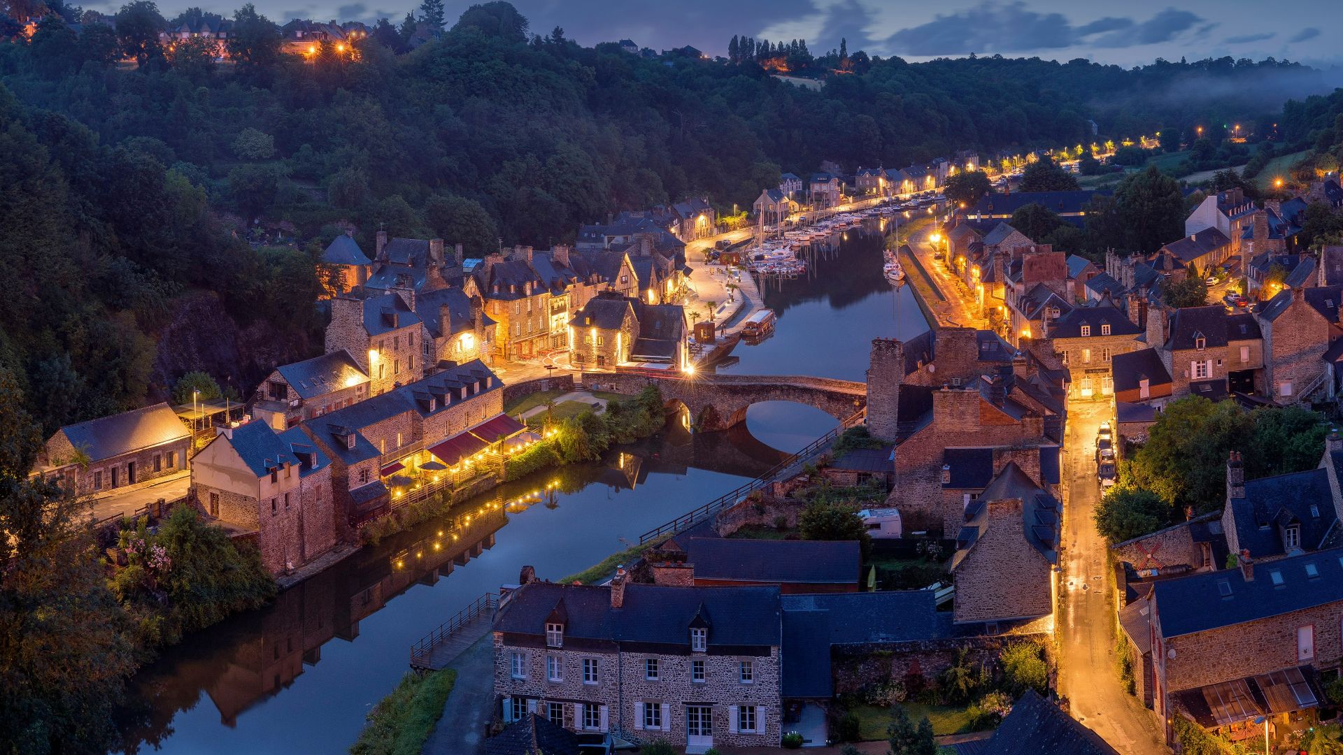 aerial photography of lighted concrete buildings at night time
