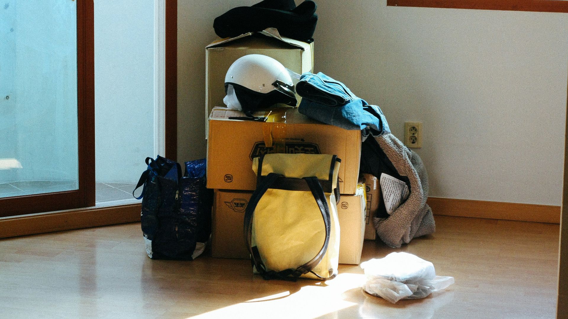 black and blue backpack on brown wooden table