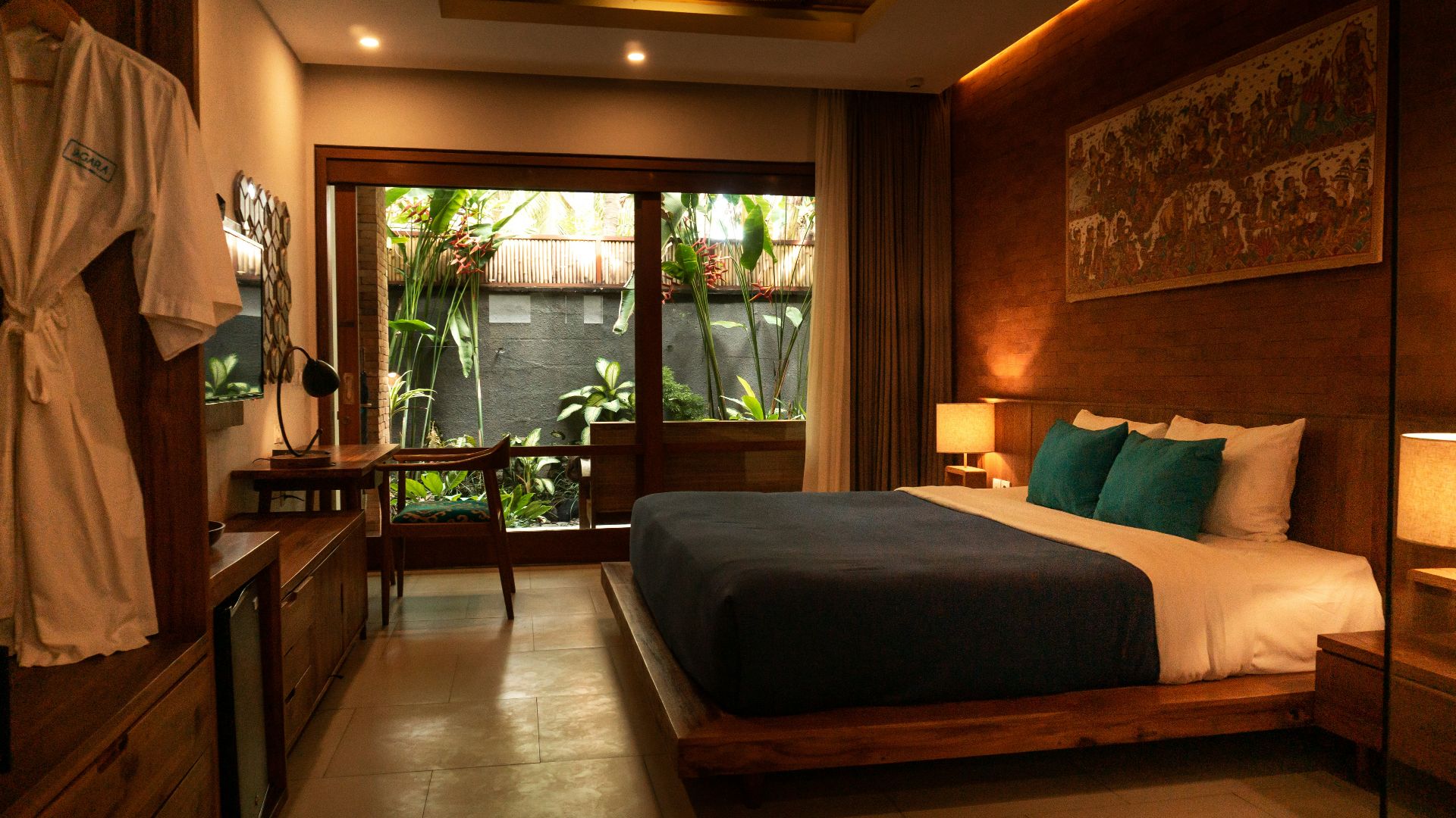 black and white bed near brown wooden table