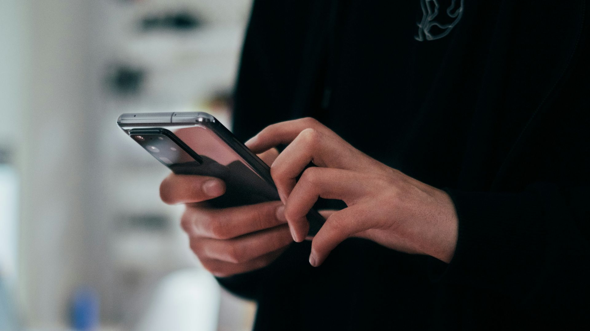 person holding black android smartphone