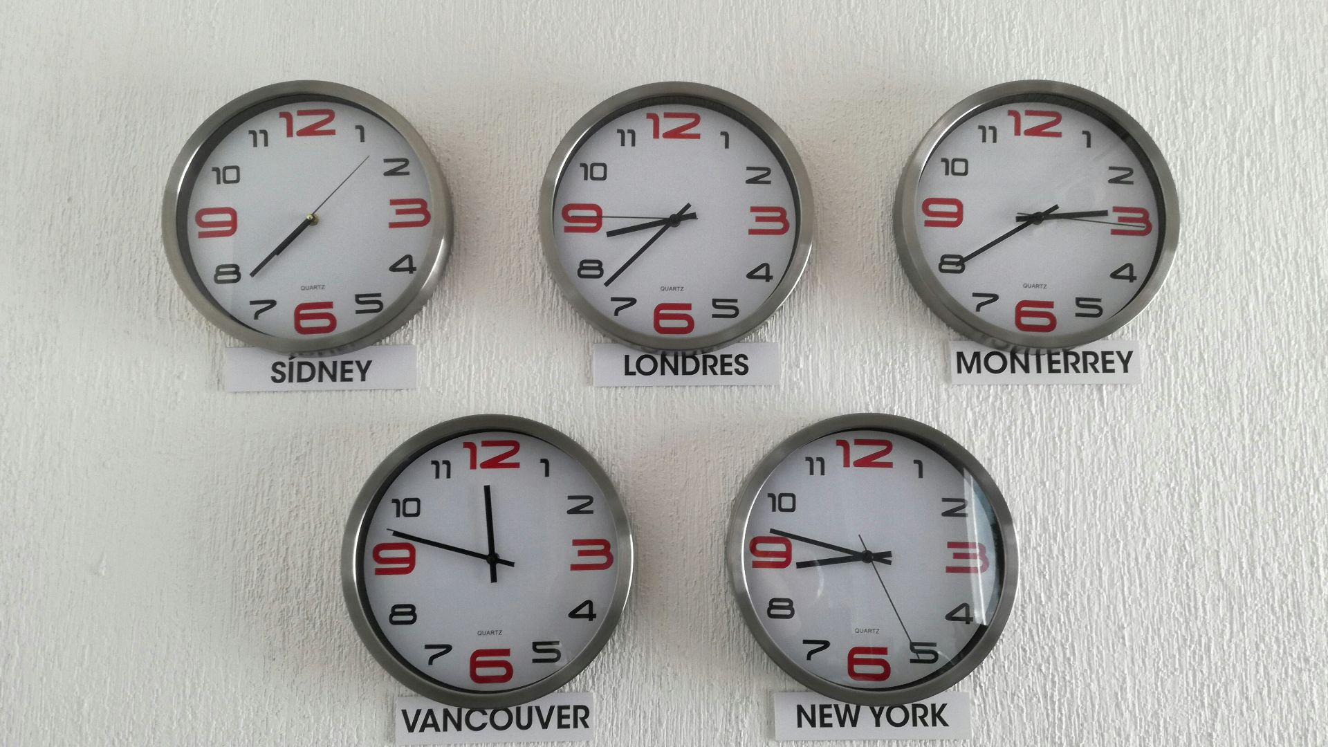 five assorted country wall clocks