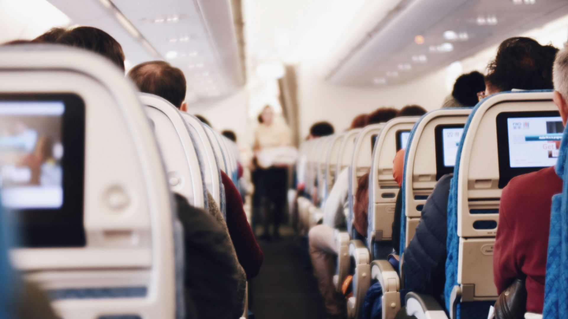 shallow focus photography of people inside of passenger plane