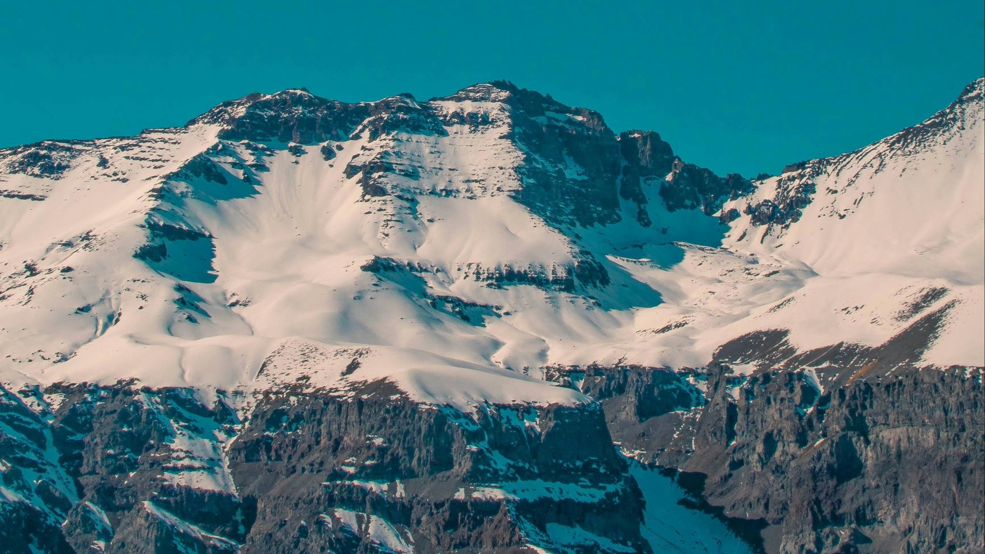 a snowboarder is doing a trick in the air