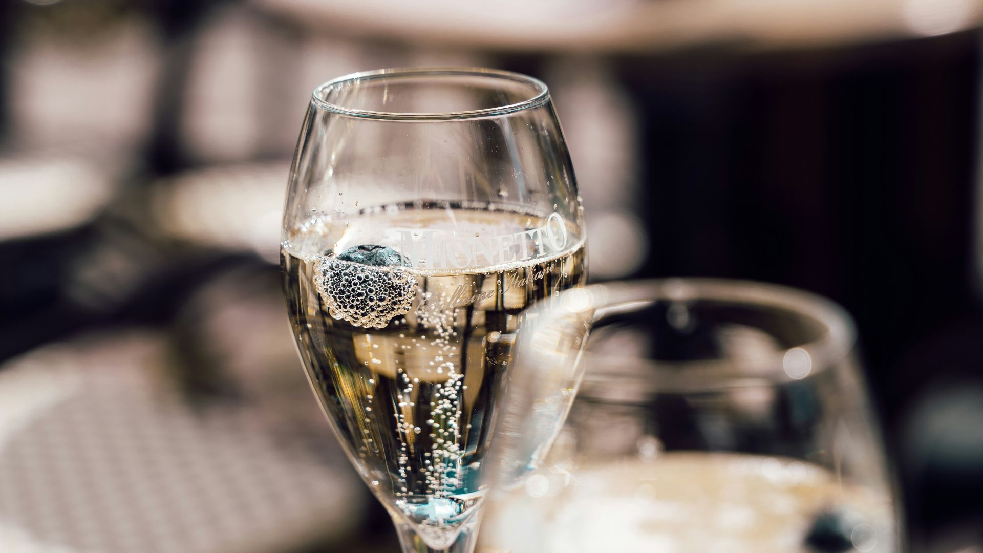 two glasses of champagne on a table