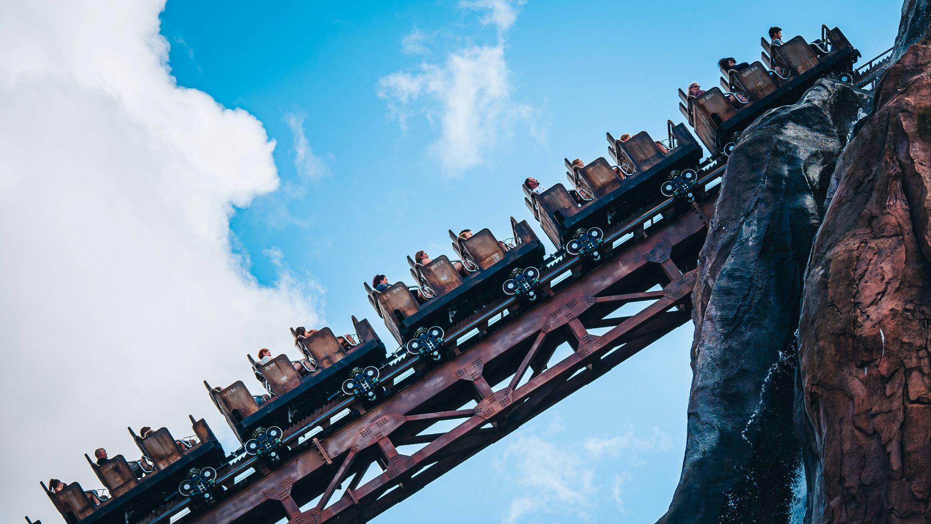 a roller coaster with many cars on top of it