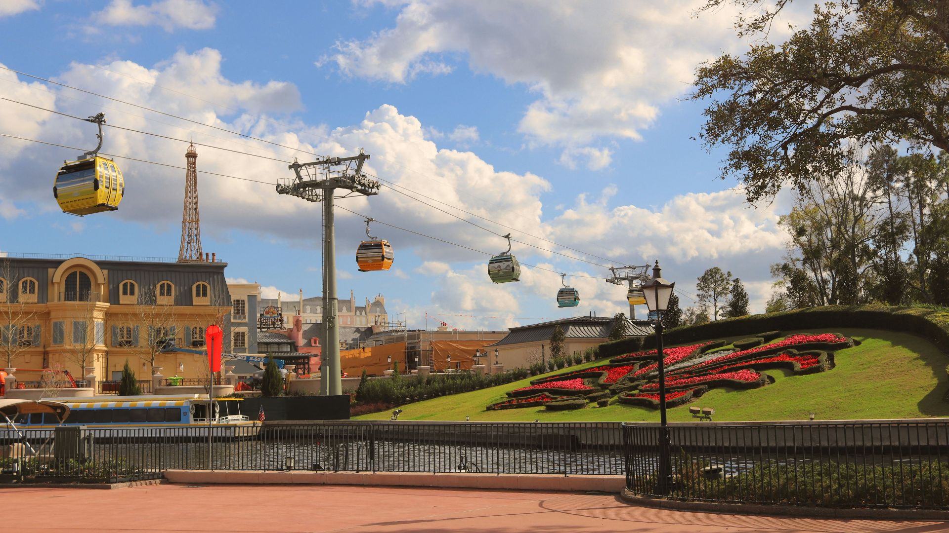 red and yellow train on track during daytime