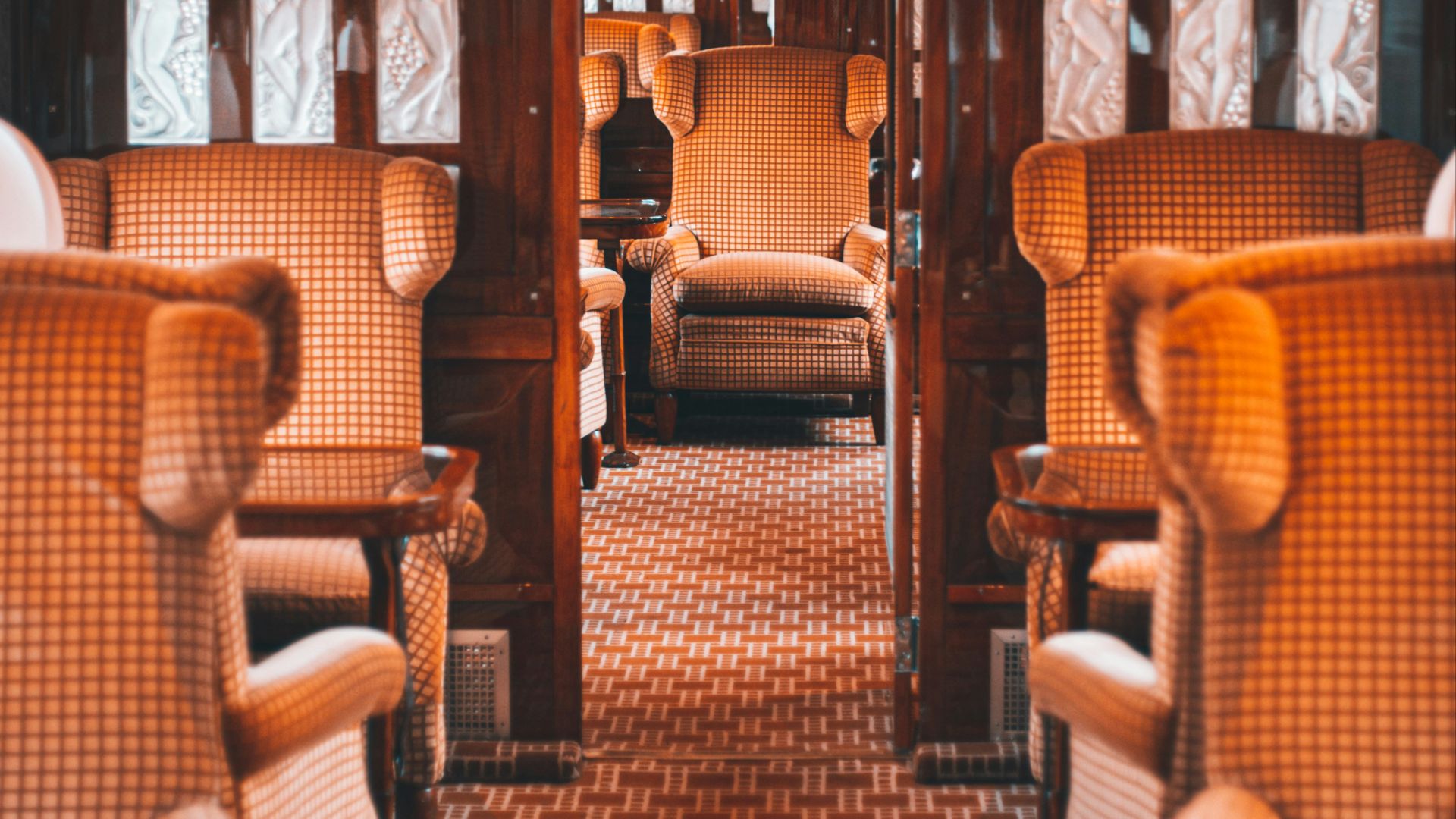 a train car filled with lots of wooden furniture