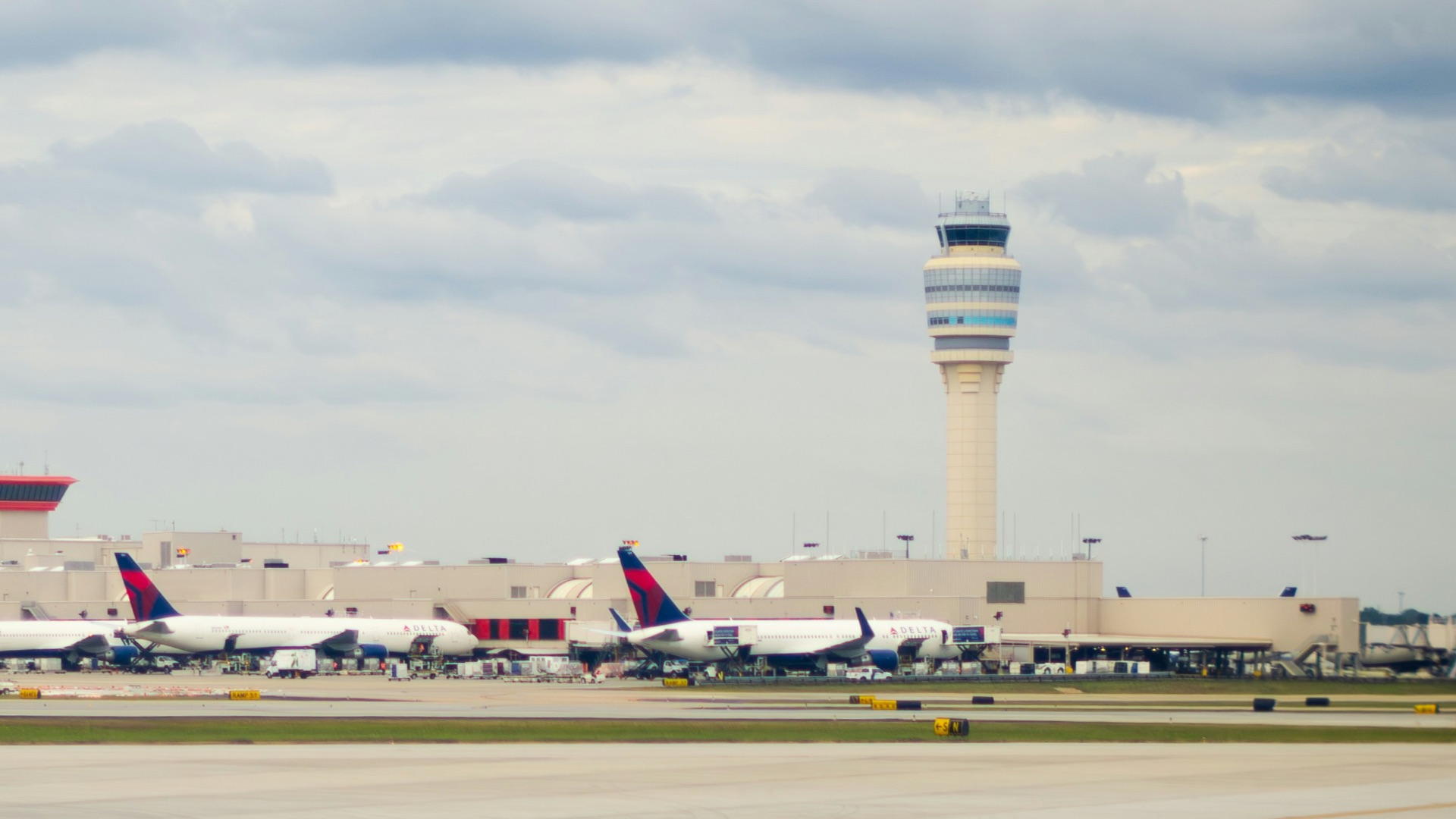 an airport with several planes parked on the tarmac