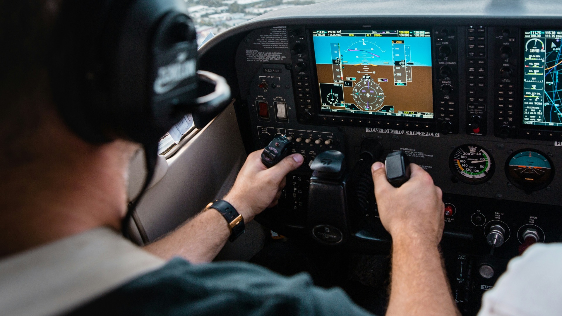man flying aircraft under cloudy sky