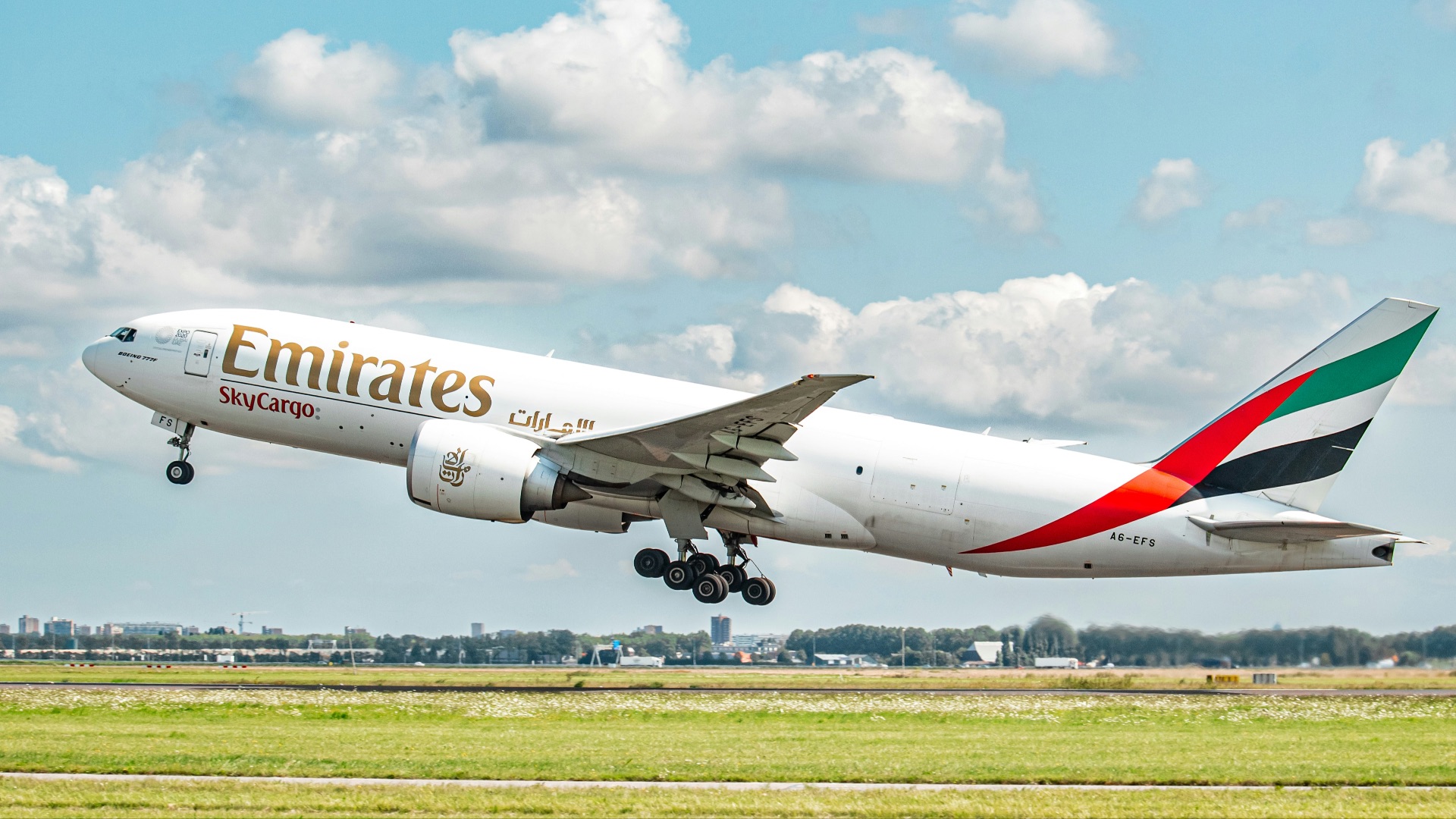 a large jetliner taking off from an airport runway