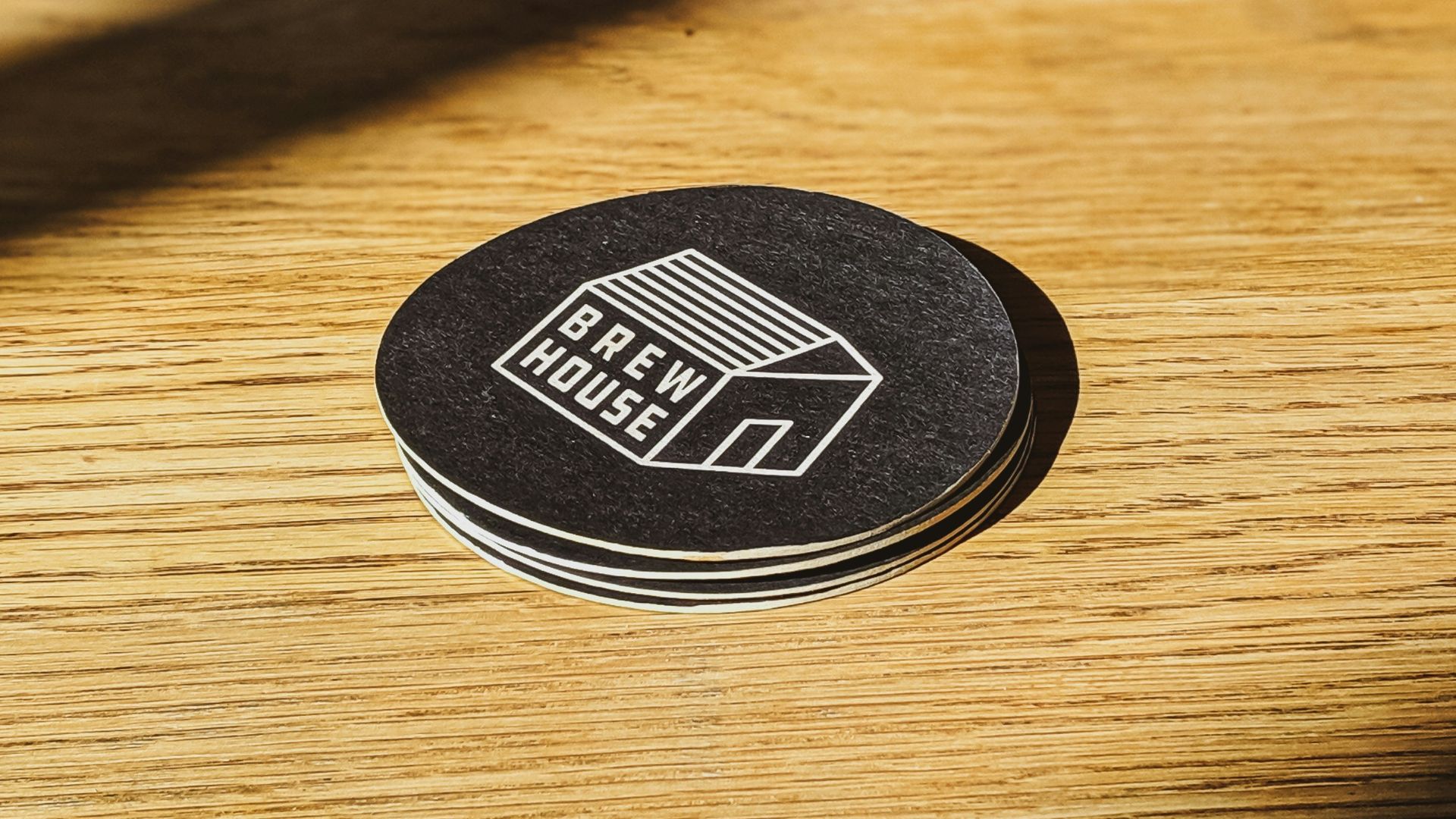 black and white round patch on brown wooden table