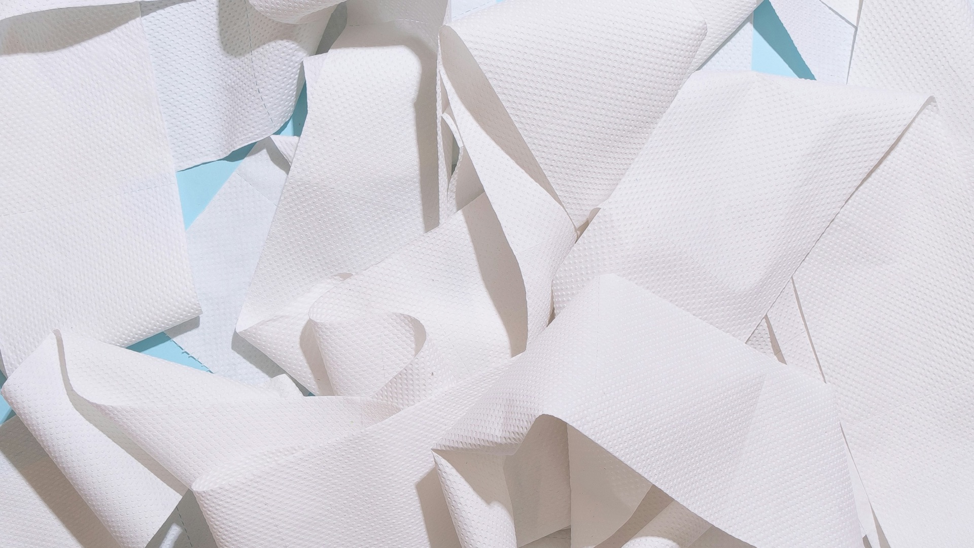 white paper on blue table