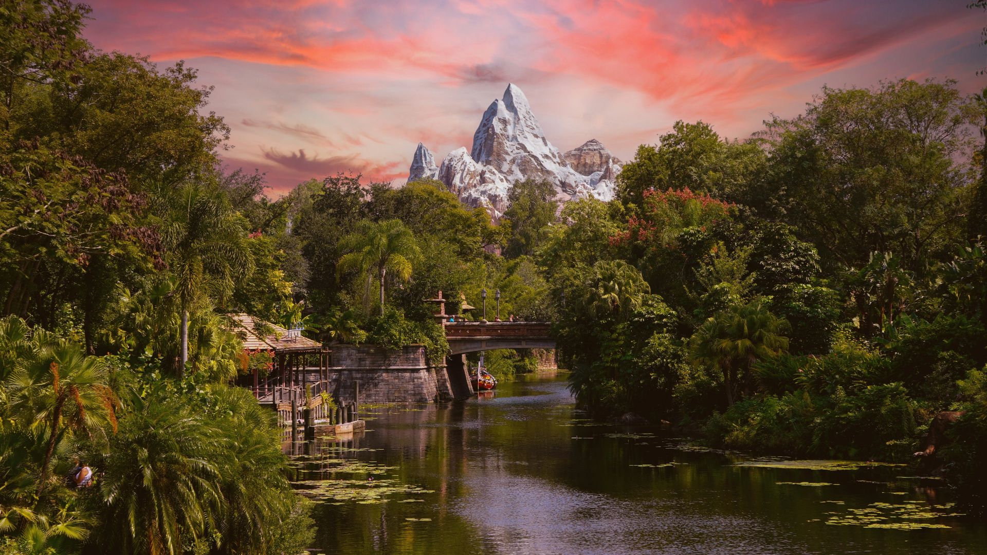 green trees near lake and mountain during daytime