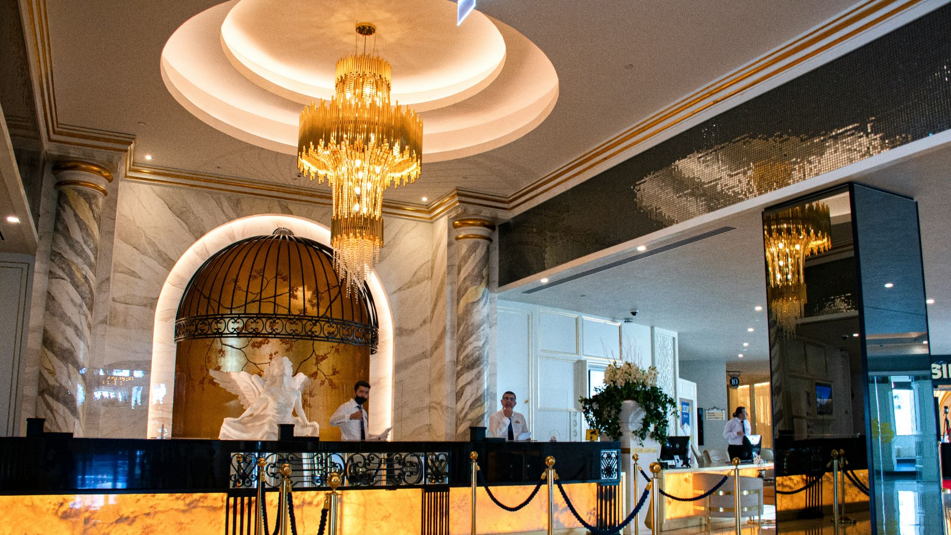 gold chandelier on white ceiling