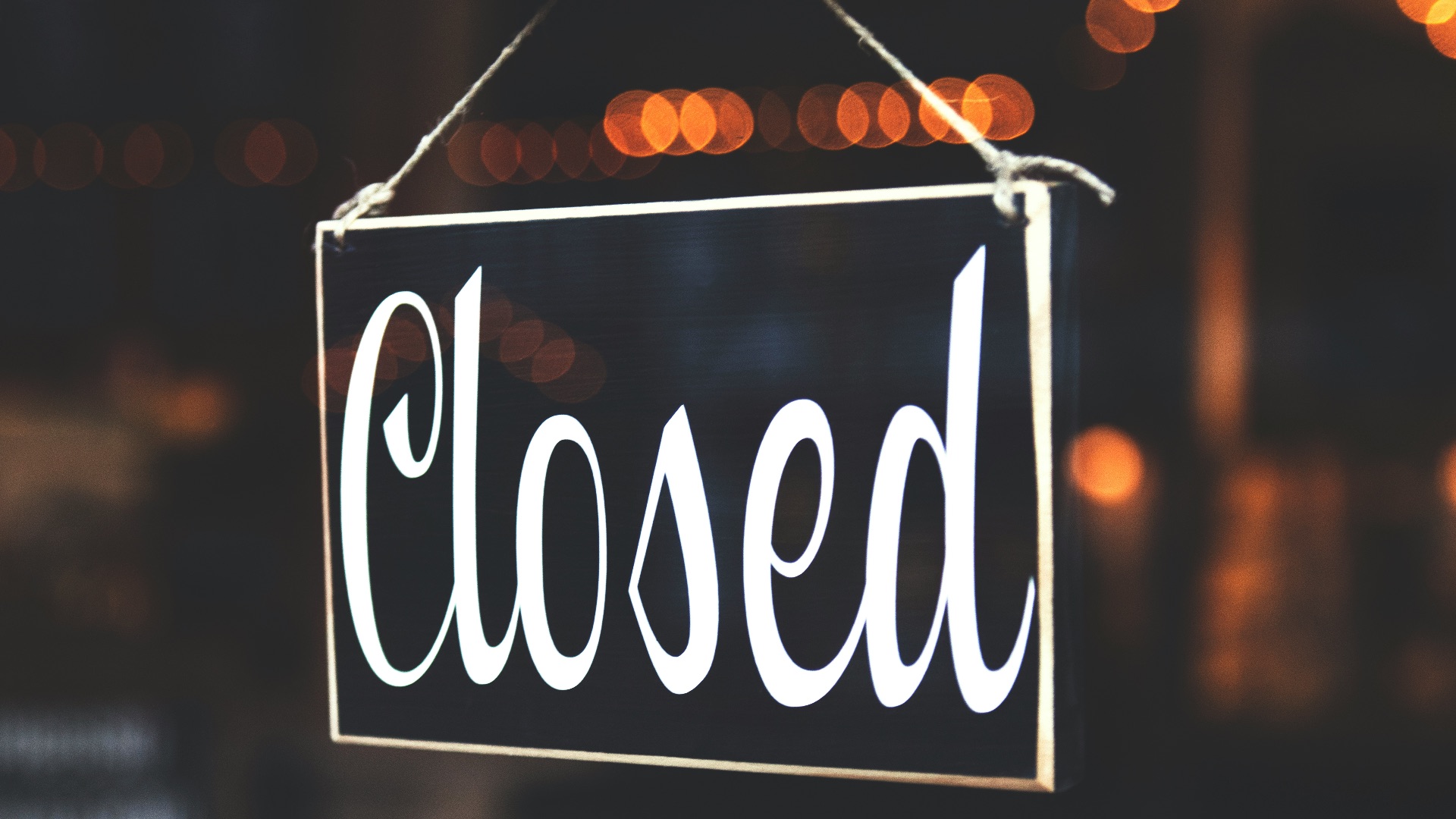 bokeh photography of closed signage