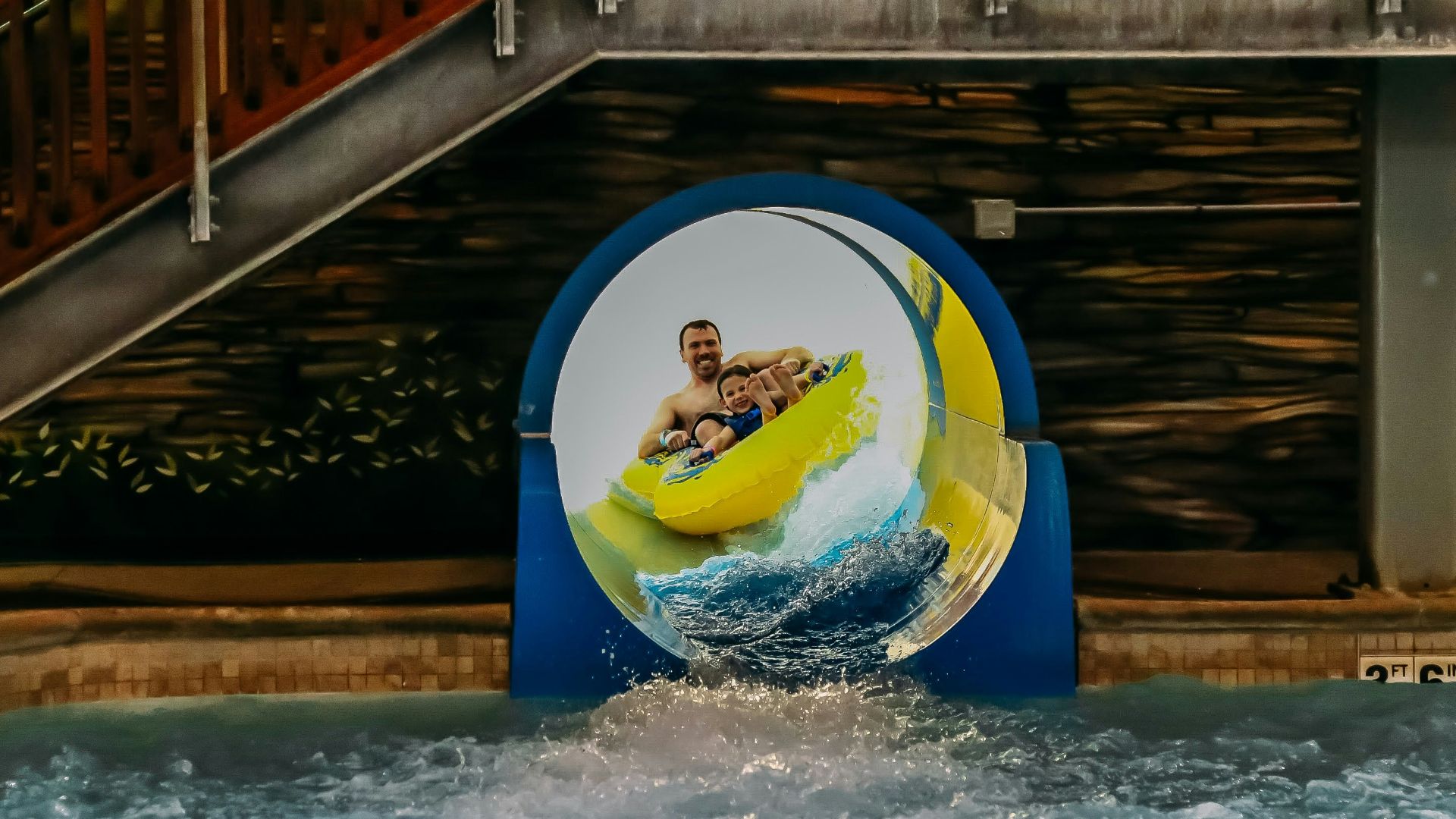 a man riding a banana boat on top of a body of water