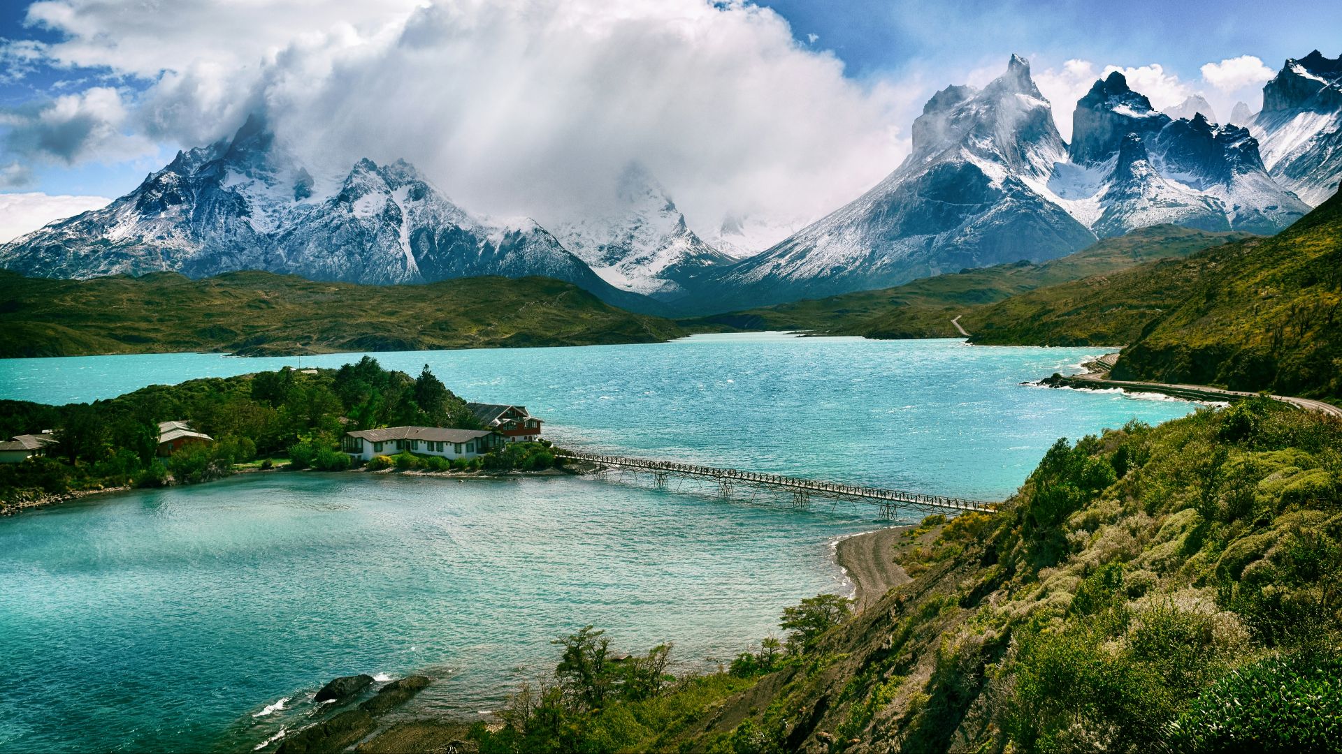lake near snow-covered mountain during daytime