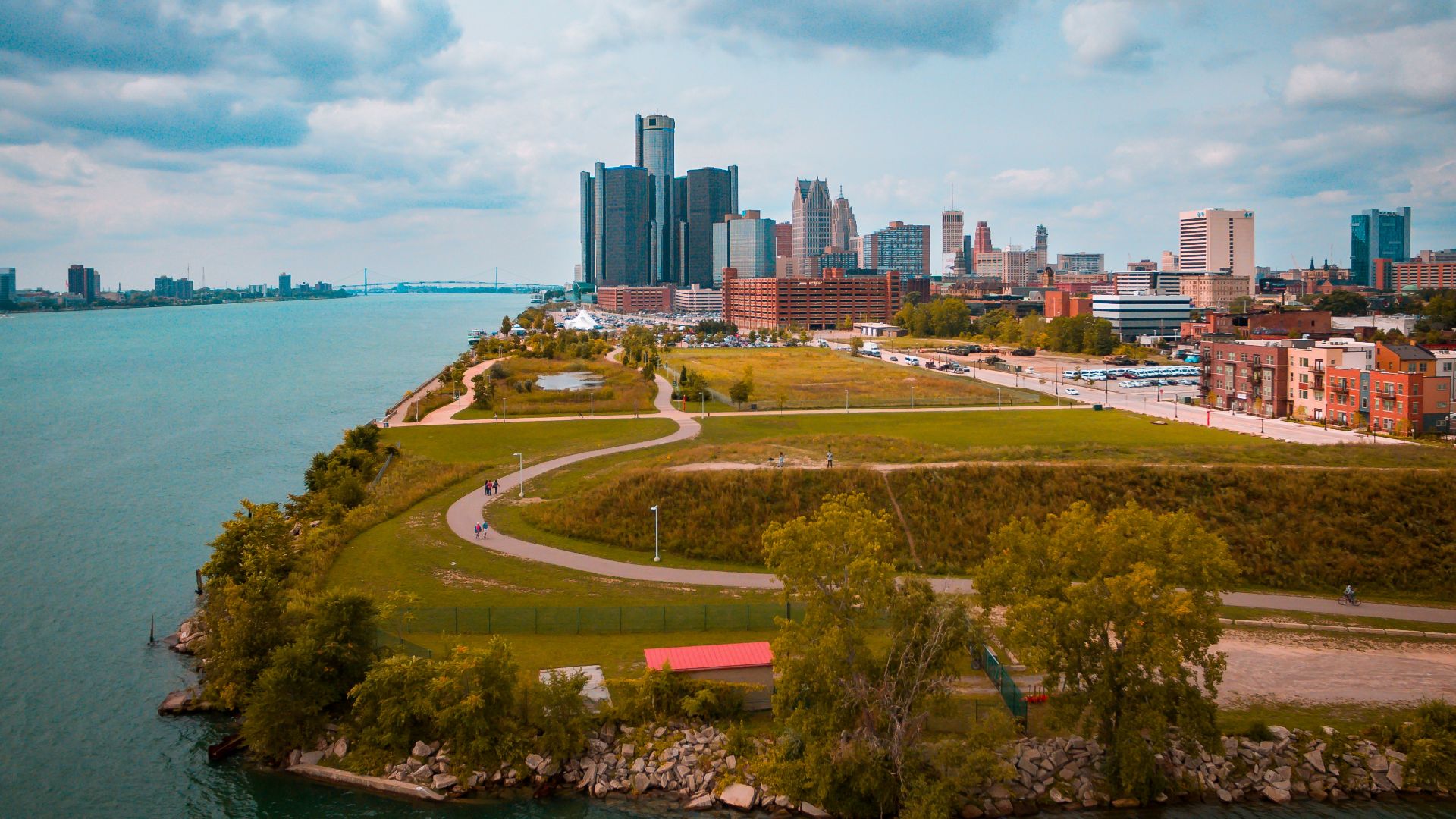 green grassfield beside a body of water