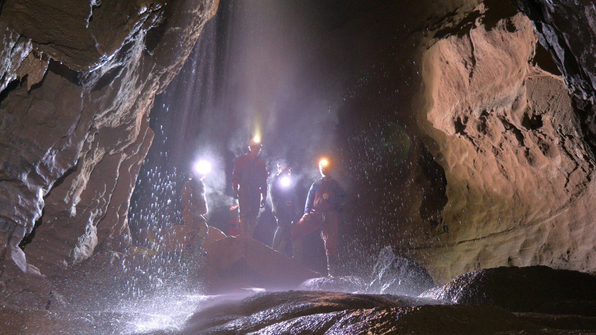 a person standing in a cave