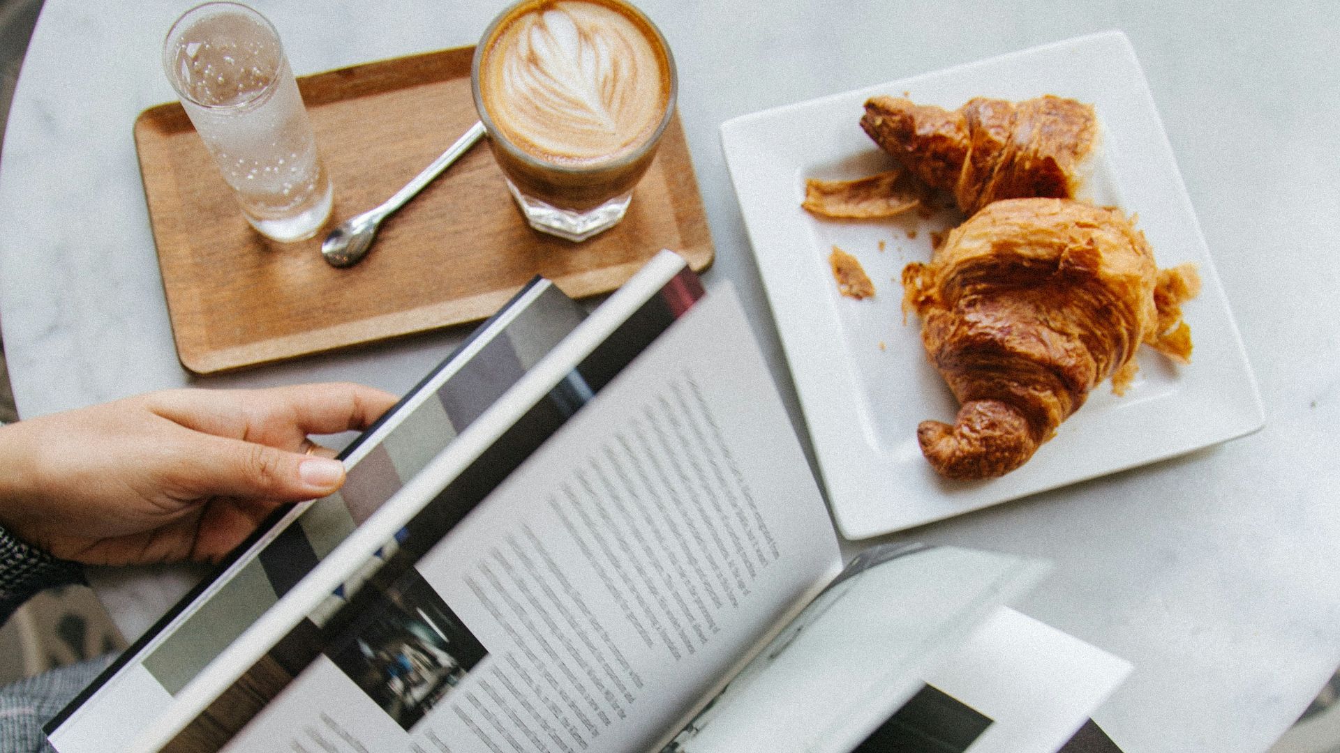 person holding white printer paper