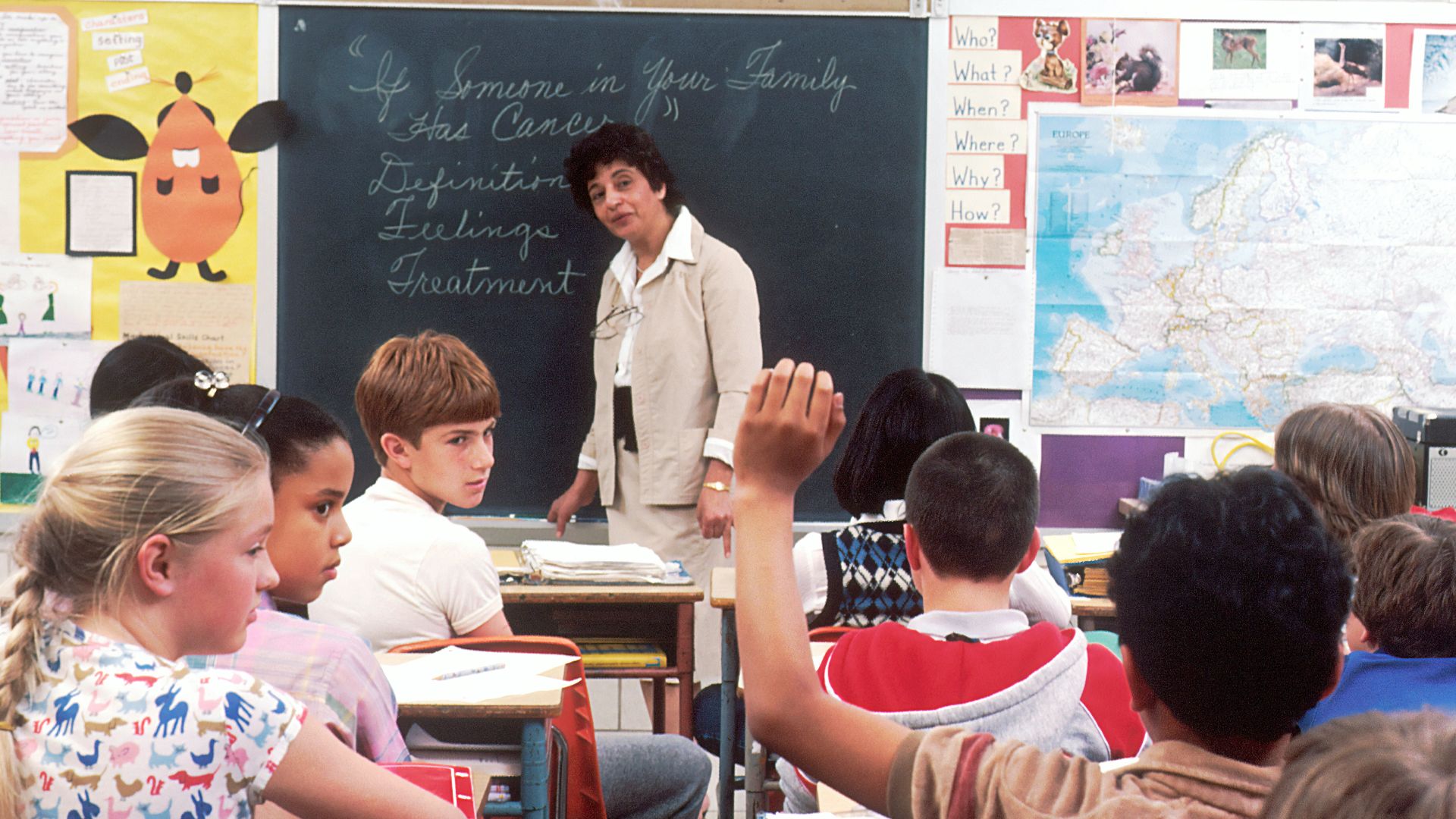 woman standing in front of children