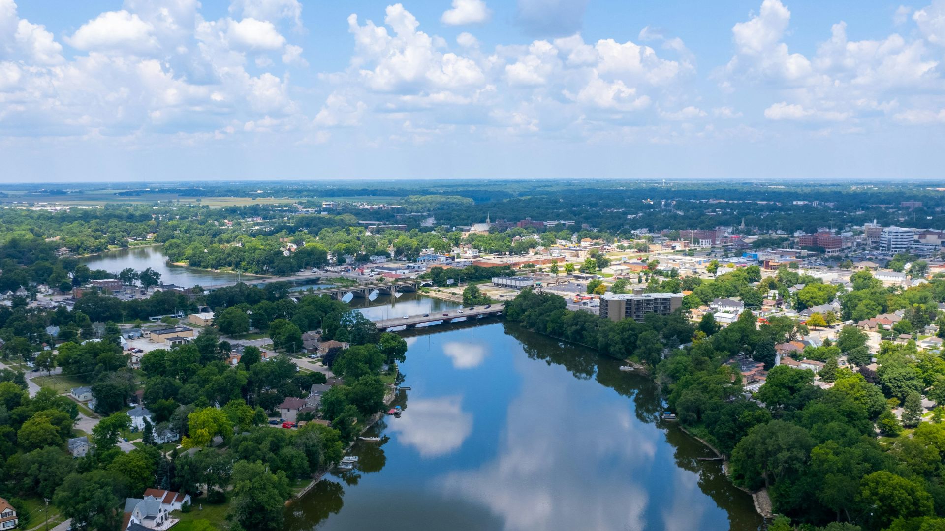 aerial view of city near body of water during daytime