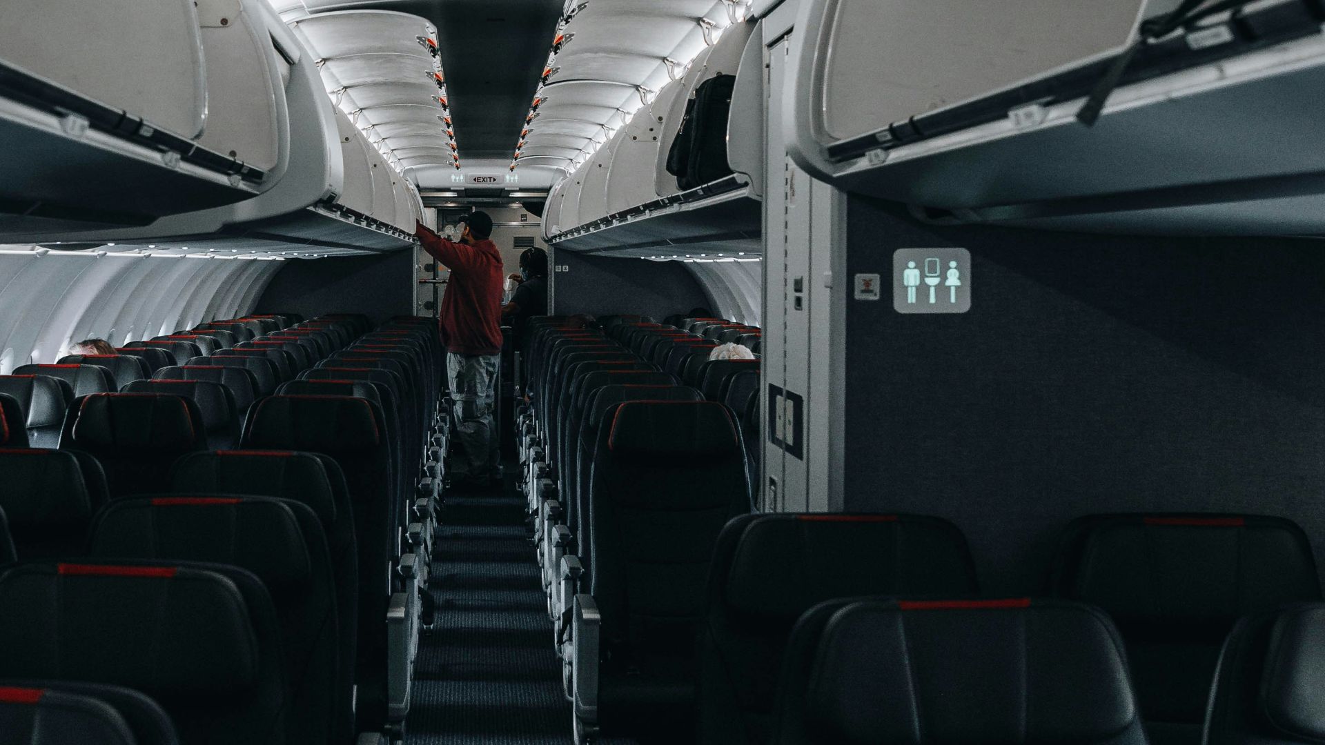 the inside of an airplane with rows of seats