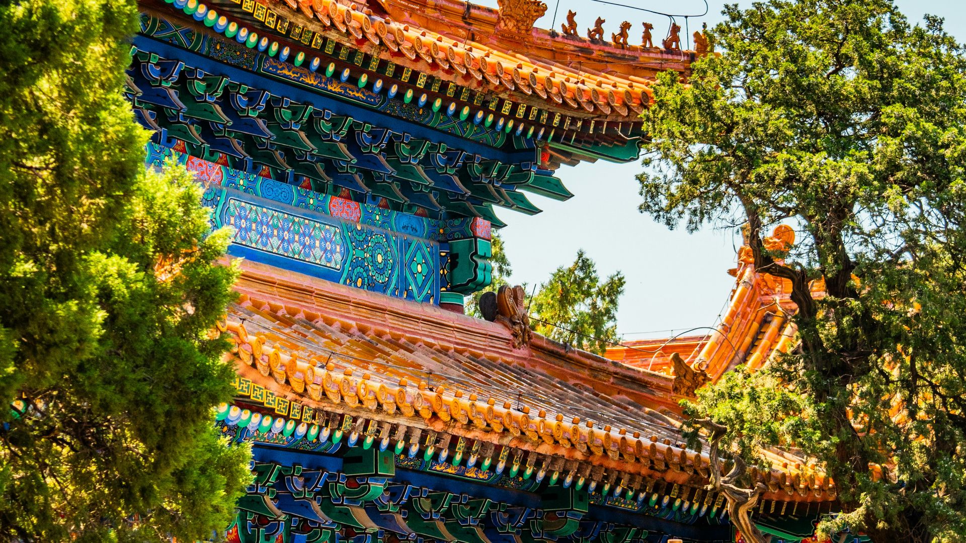 an oriental building with a lamp post in front of it