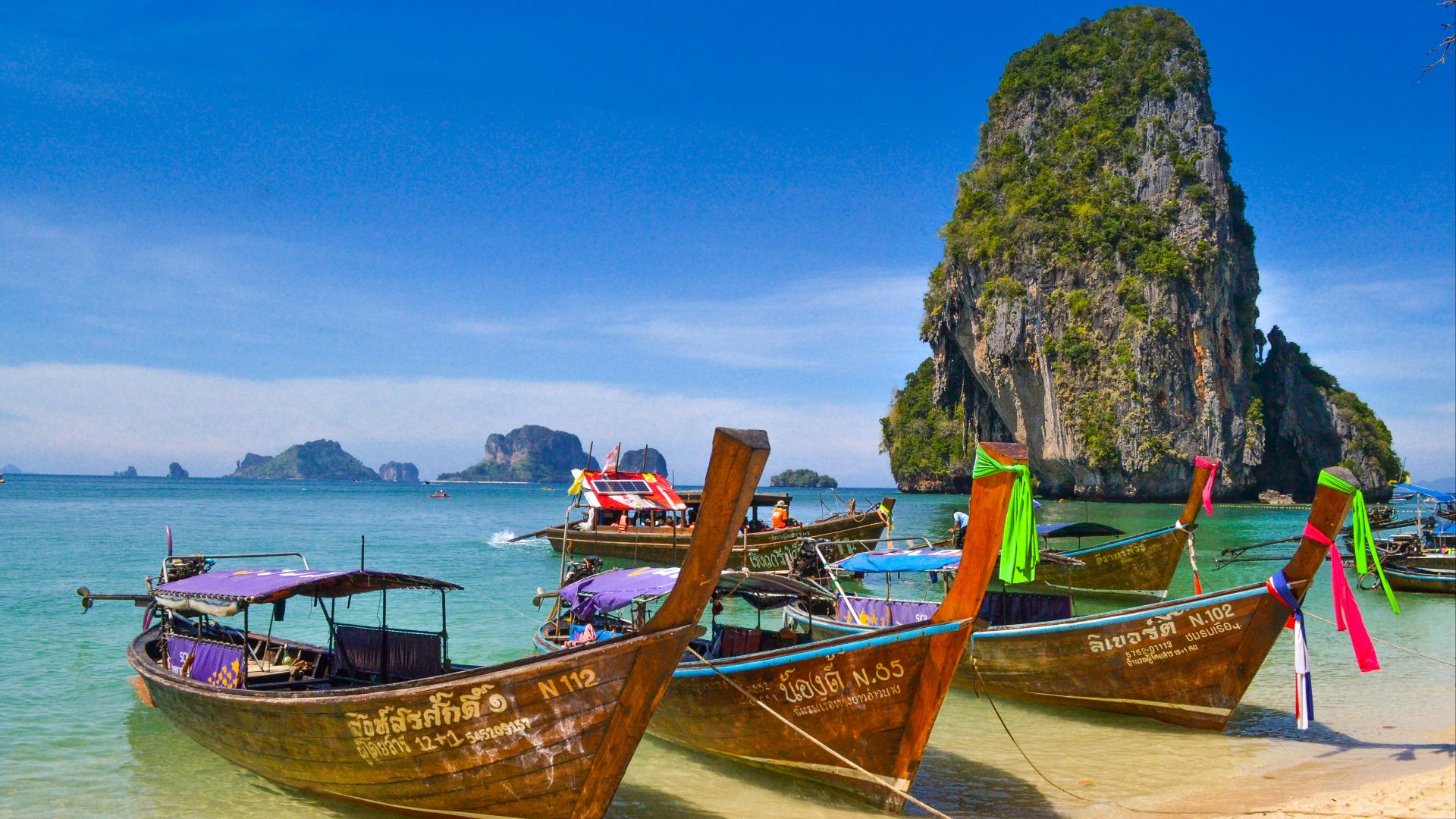 five brown wooden boats