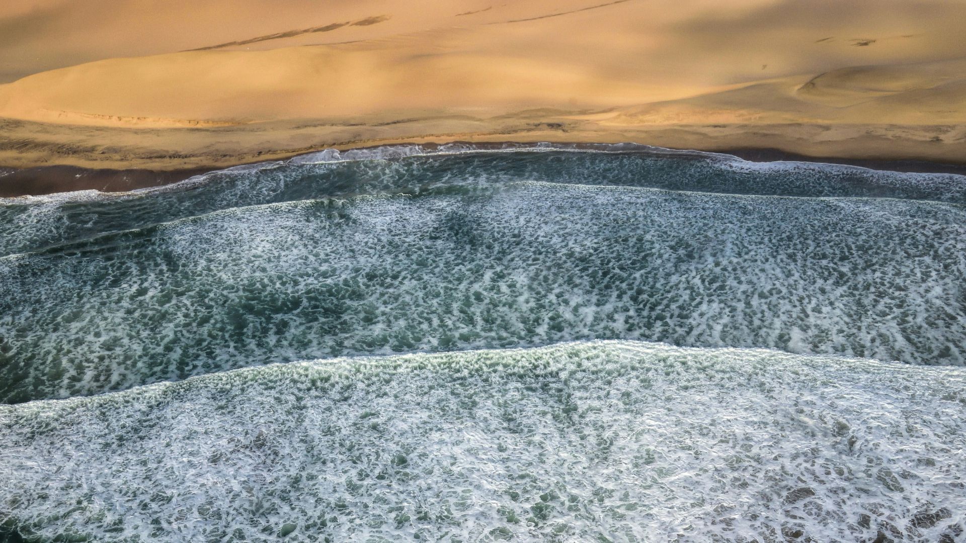 sea waves near desert