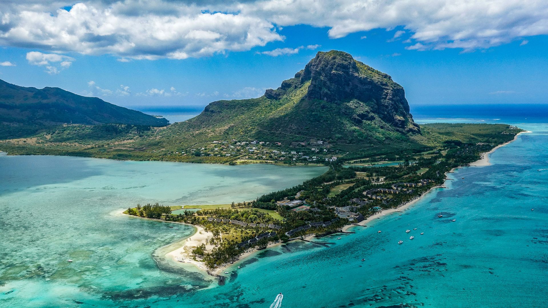 aerial photography of island beside body of water