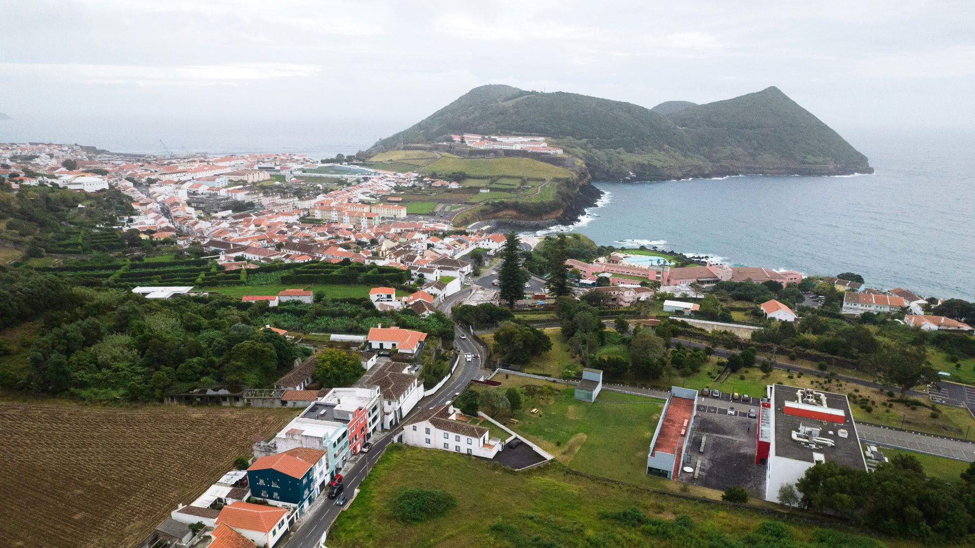 A bird's eye view of a town and a body of water