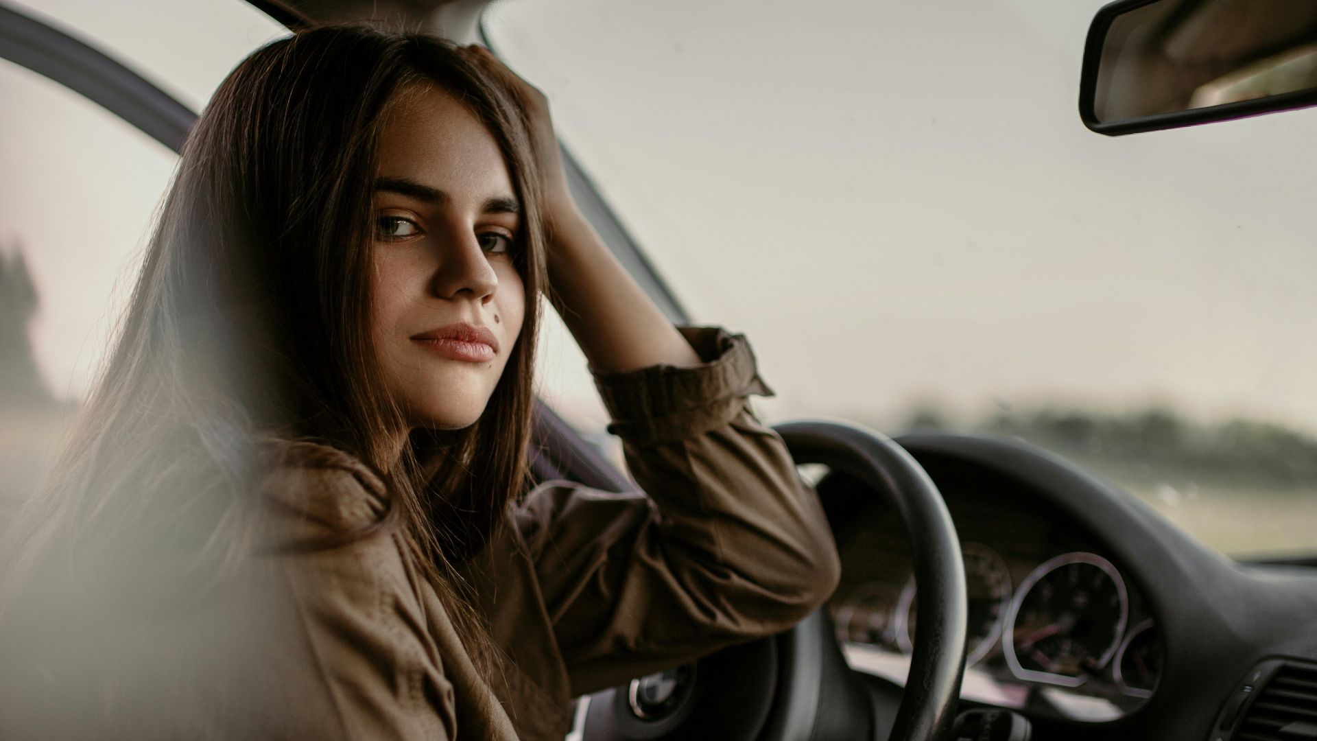 woman sitting inside car