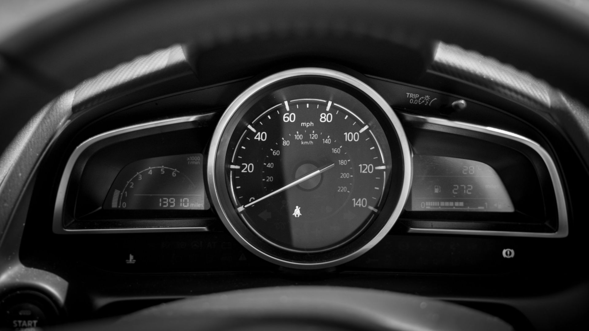 black and white car speedometer