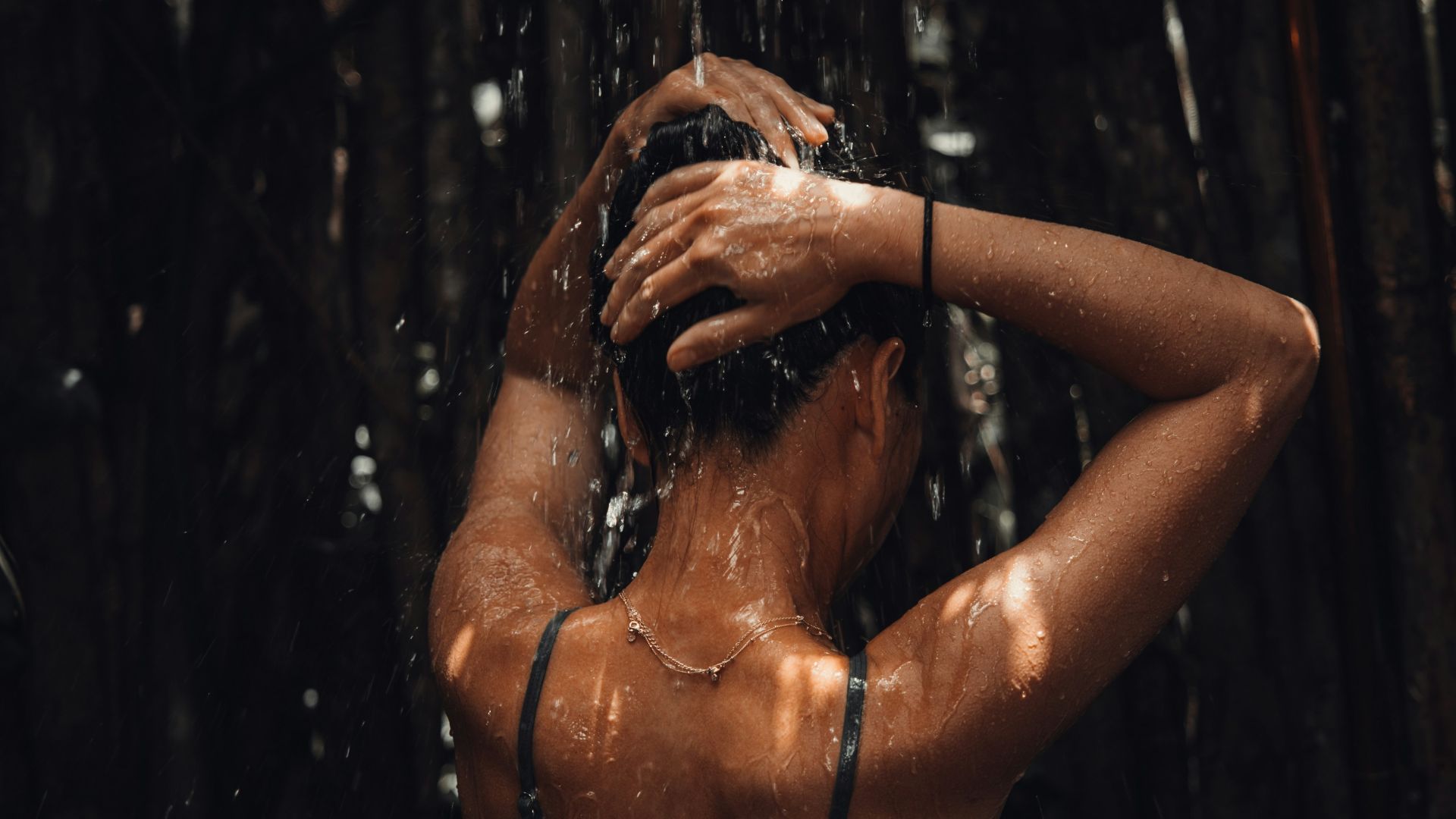 topless woman in black and white floral skirt