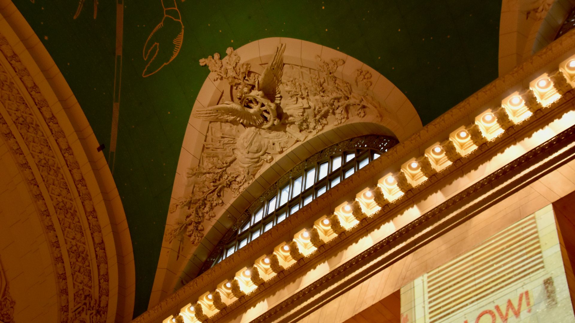 Grand central terminal ceiling detail with ornate carvings.