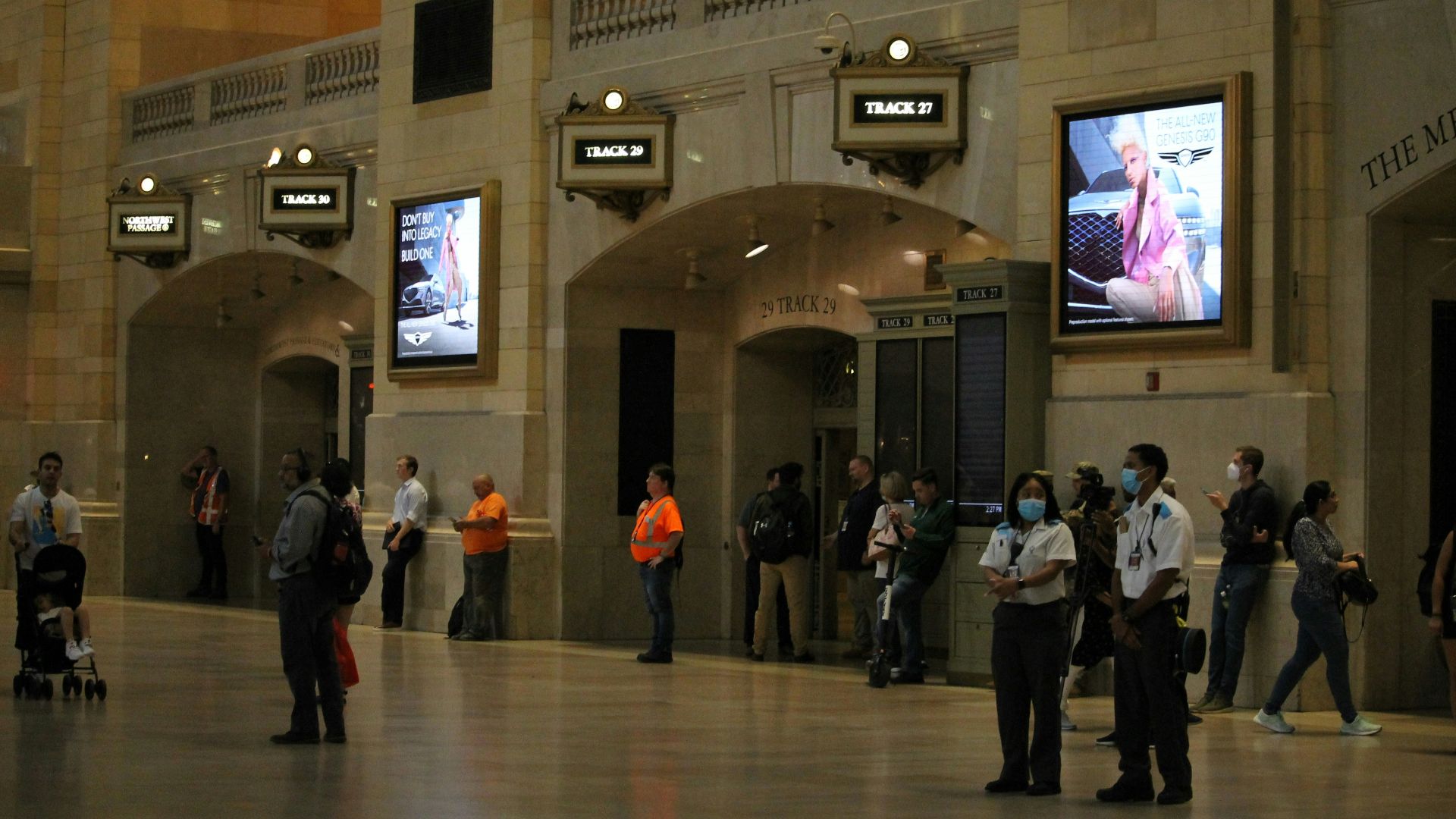 A group of people standing in a large building