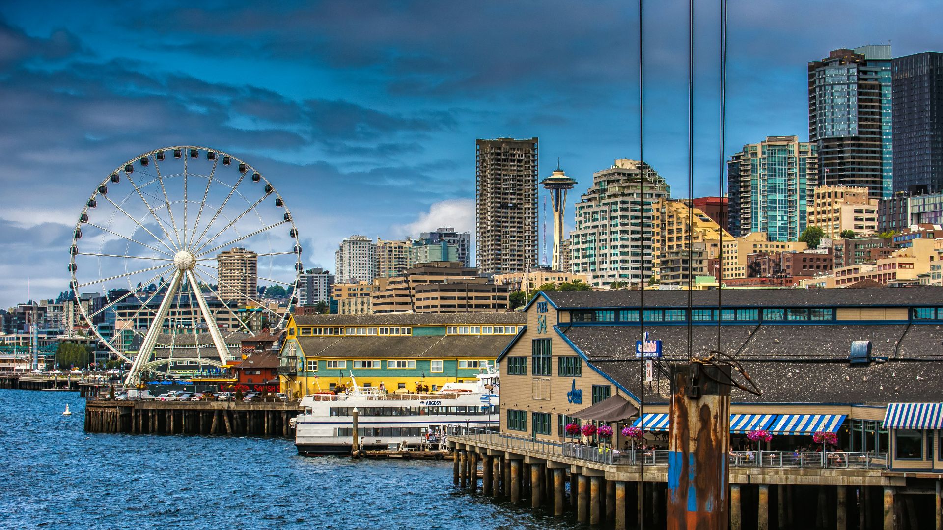 ferris wheel near body of water during daytime