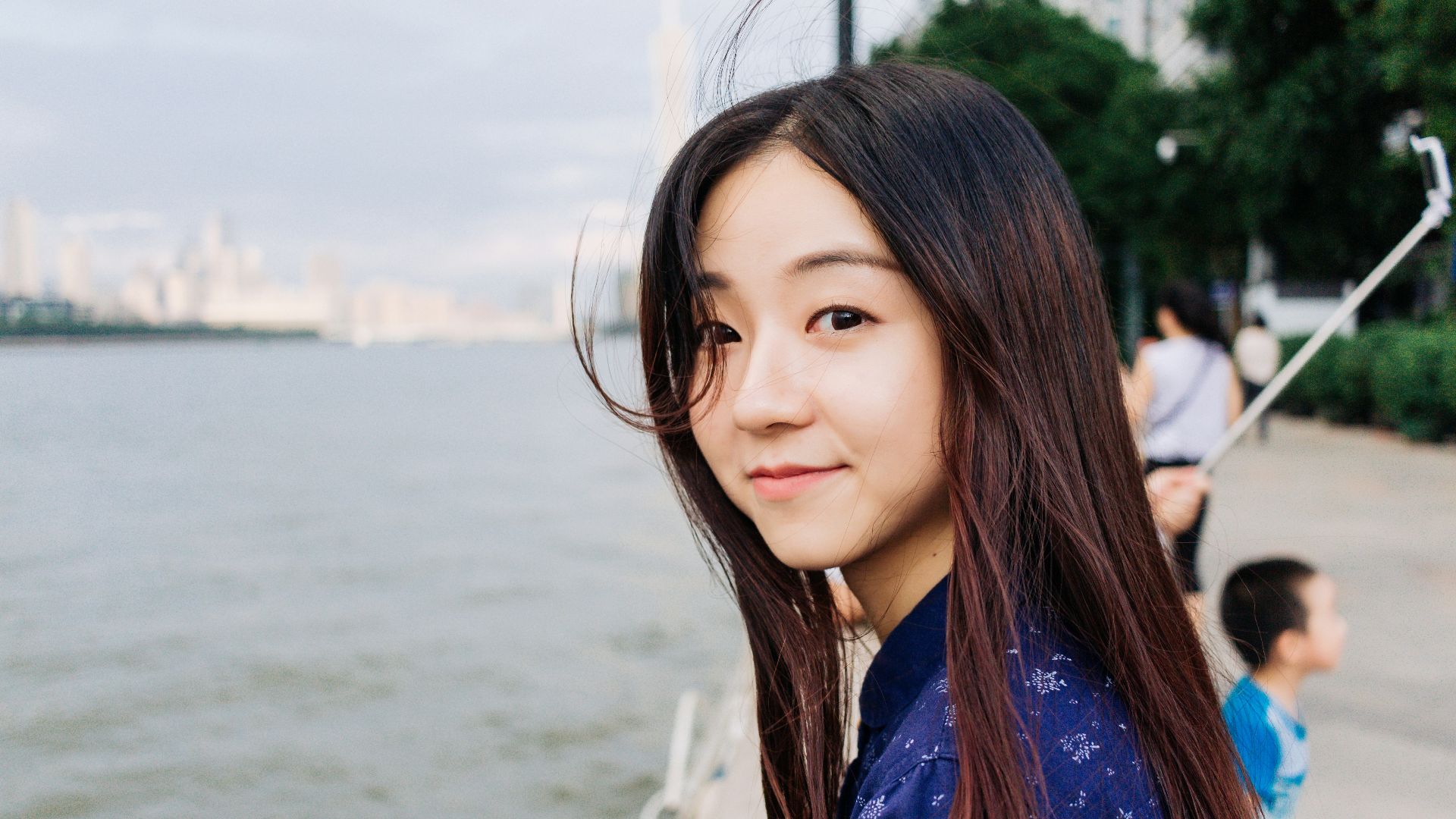 woman standing near body of water