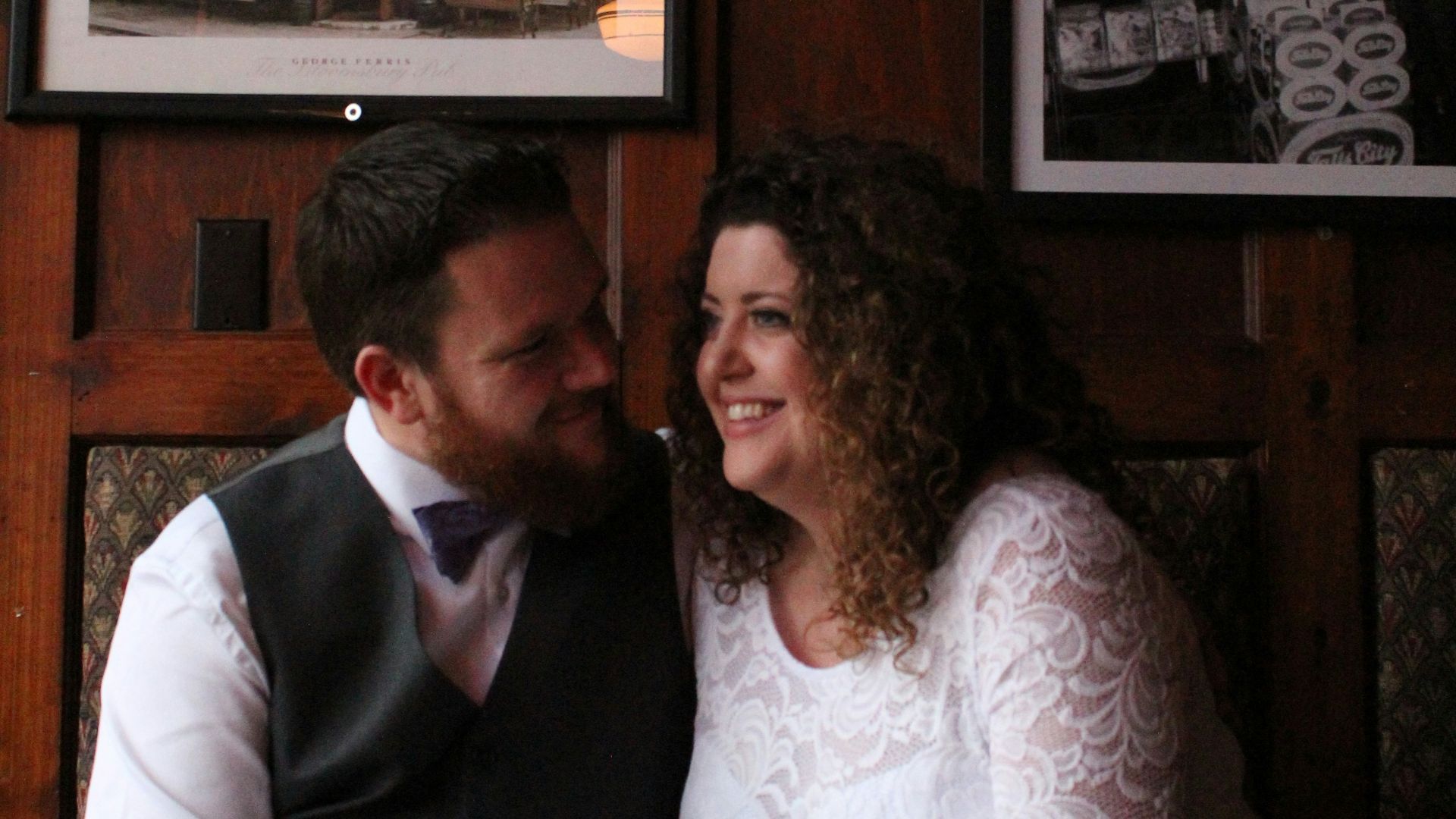 a man and woman sitting at a table