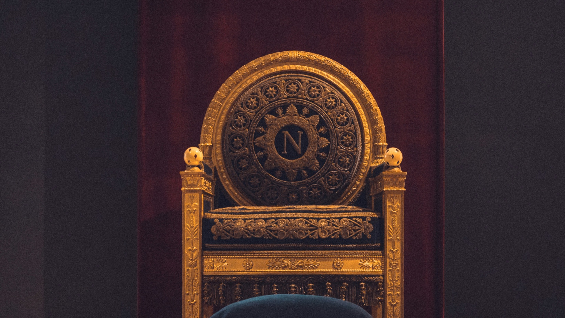 gray and black wooden chair with fabric cushion