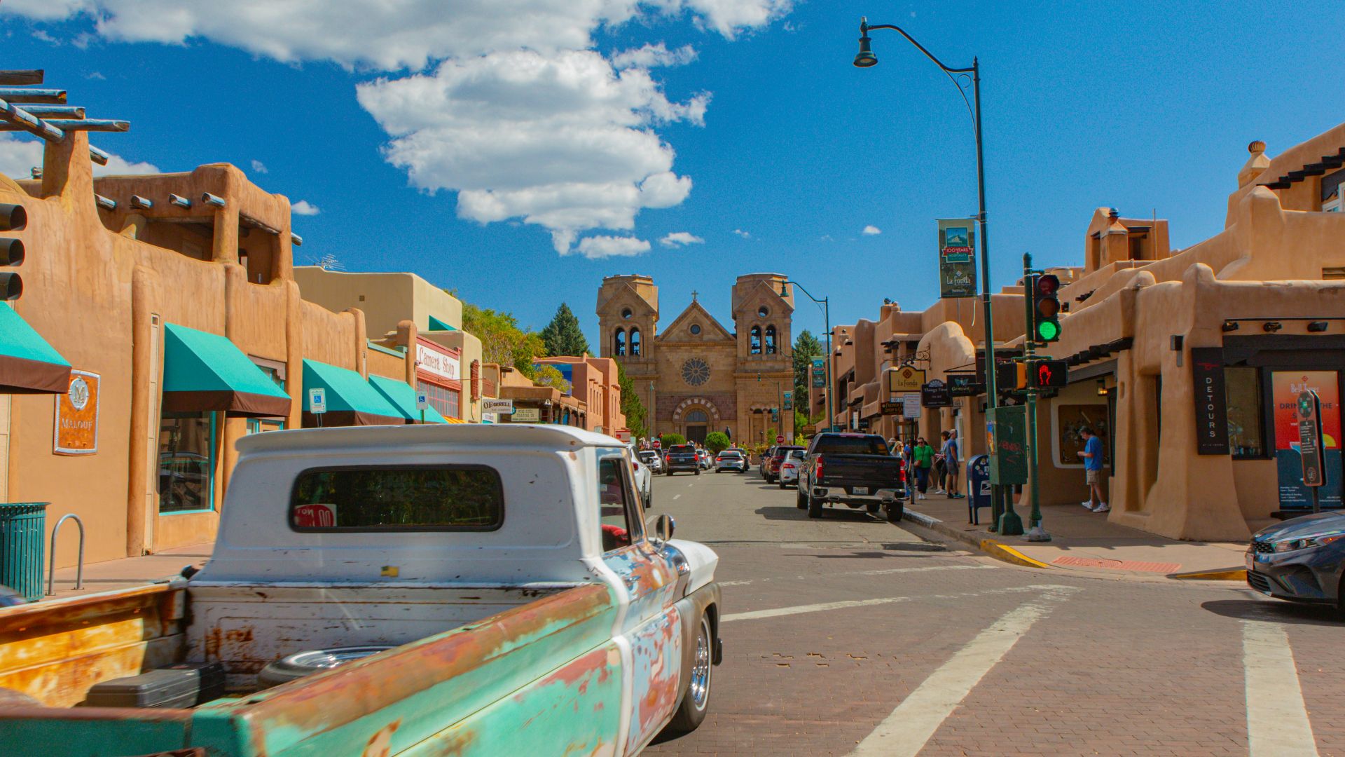 A street with cars parked on the side of it