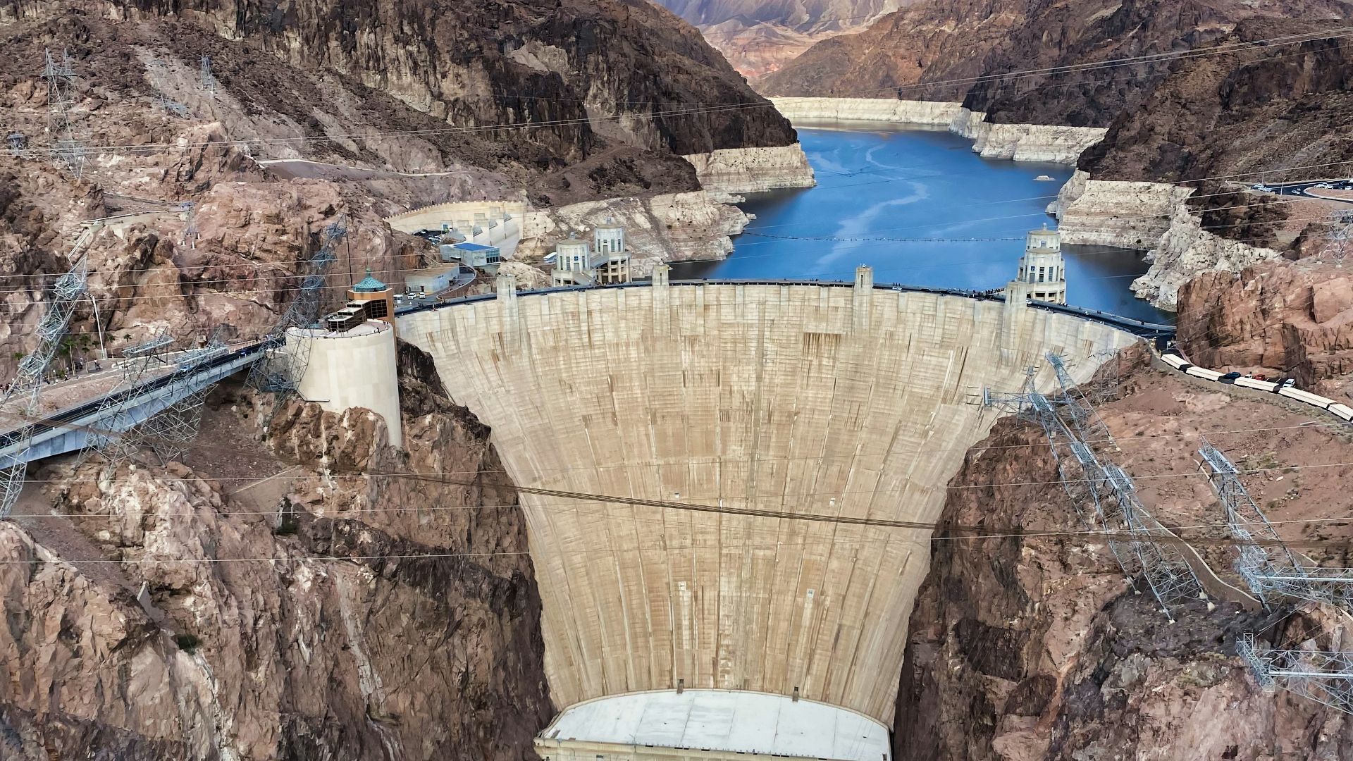white and brown concrete building near body of water during daytime