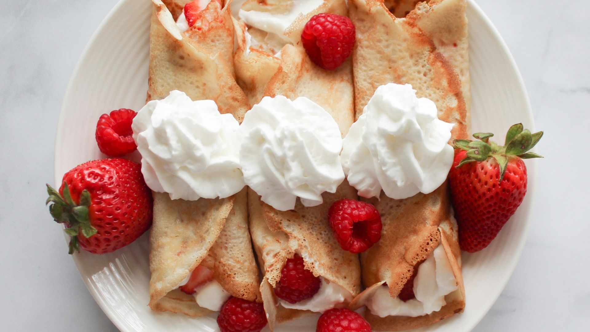 strawberry and banana on white ceramic plate