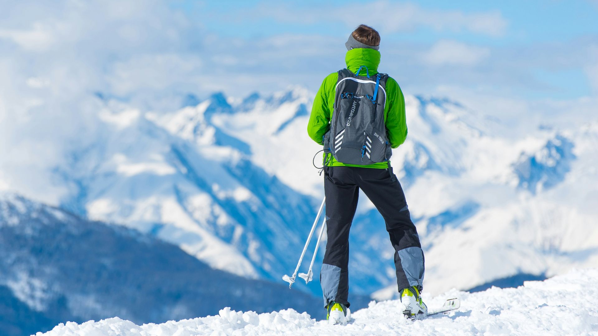 man standing on top of snow mountain