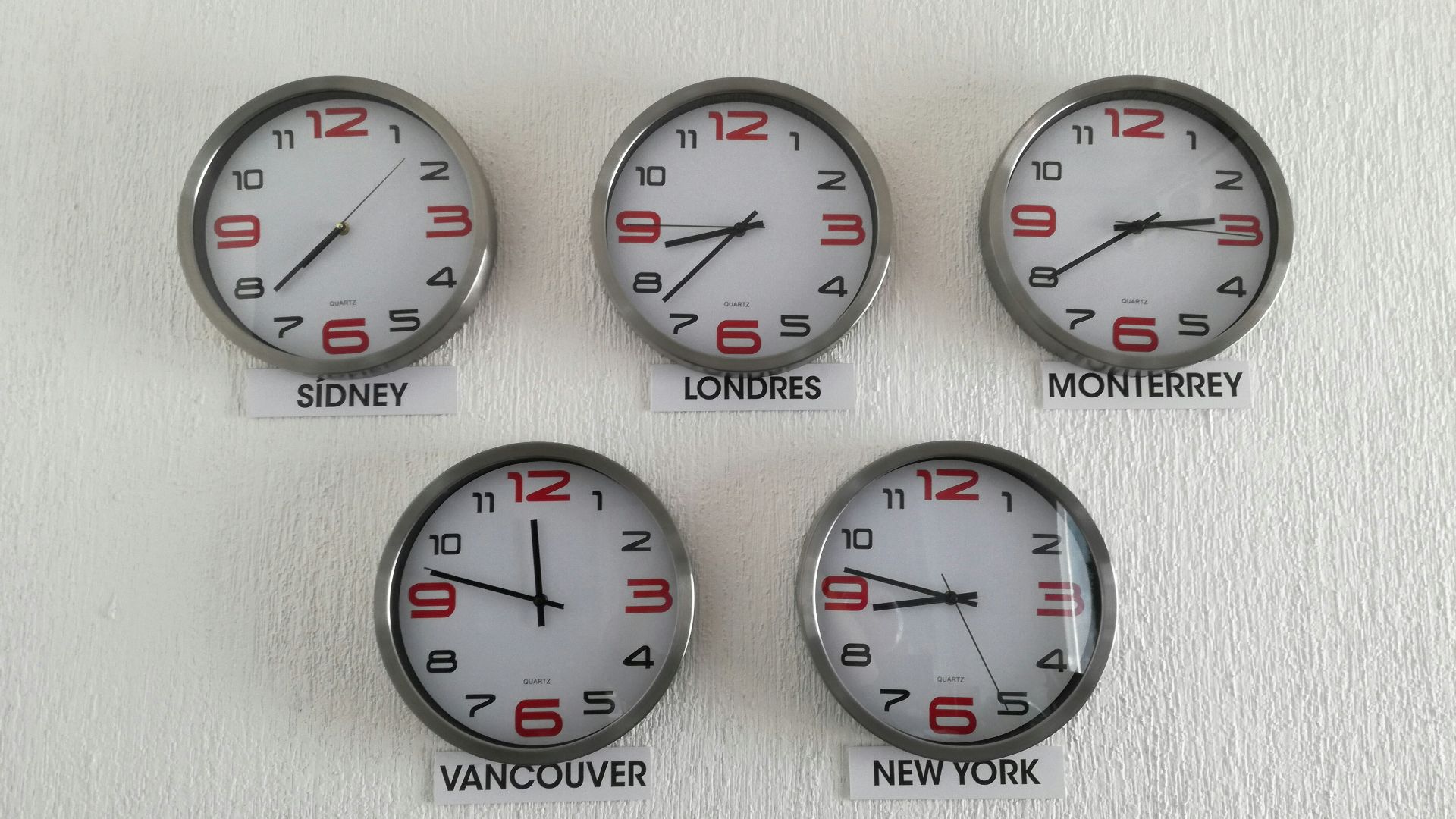 five assorted country wall clocks