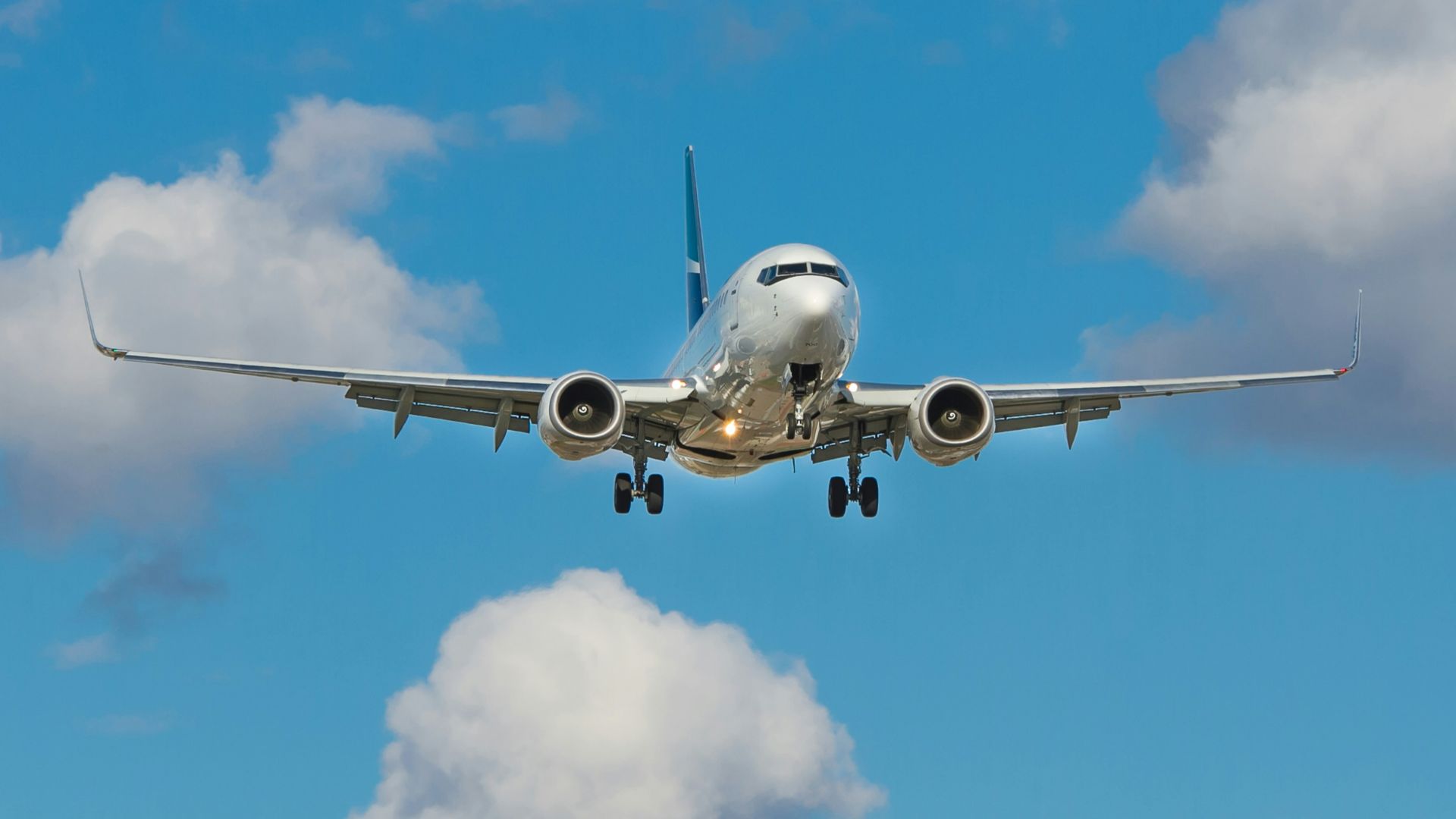 white airplane on mid air